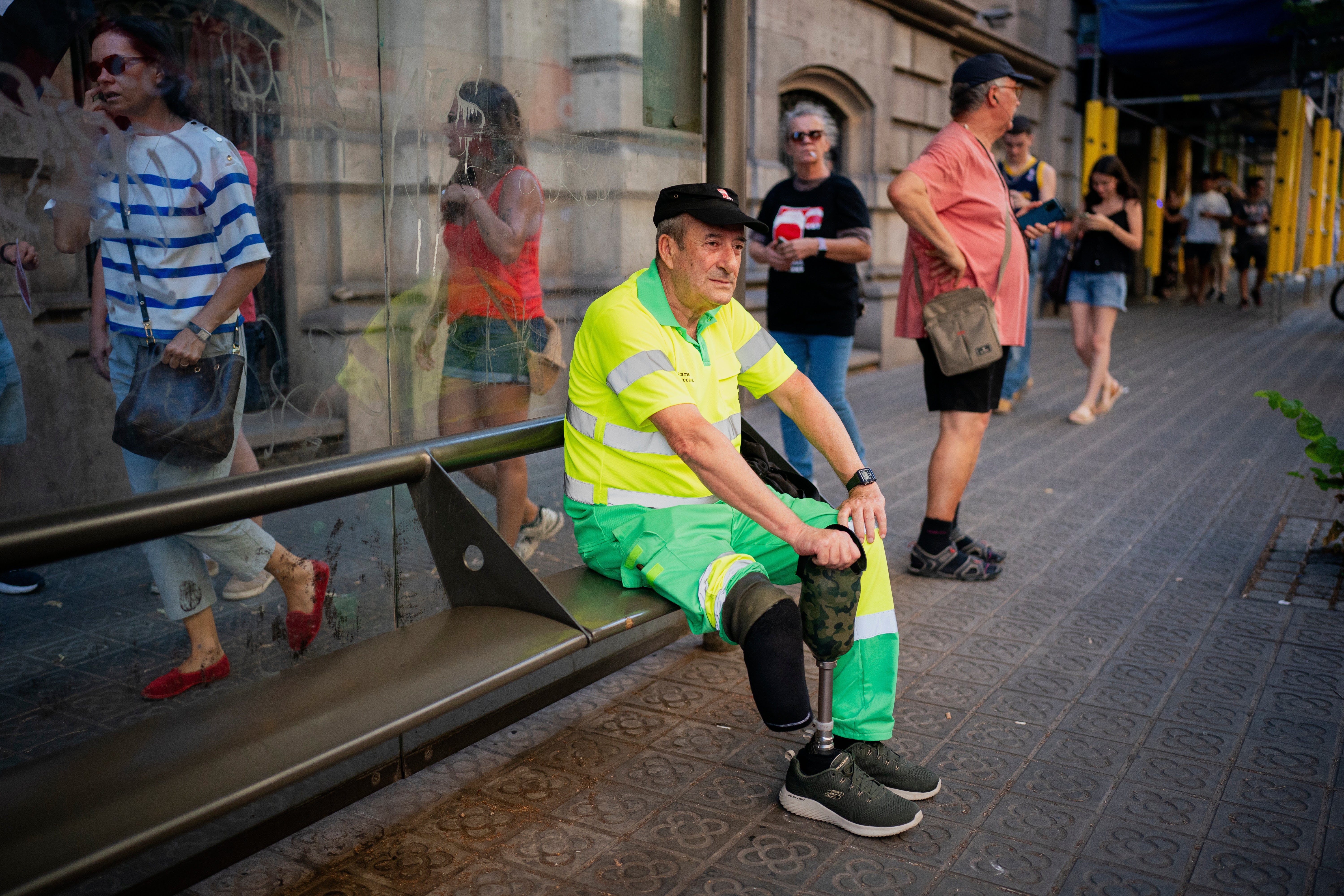 Street cleaner Raúl Rodriguez rests during a protest over the death of fellow cleaner during a recent heat wave in Barcelona, Spain, Wednesday, July 16, 2025. (AP Photo/Joan Mateu Parra, File)