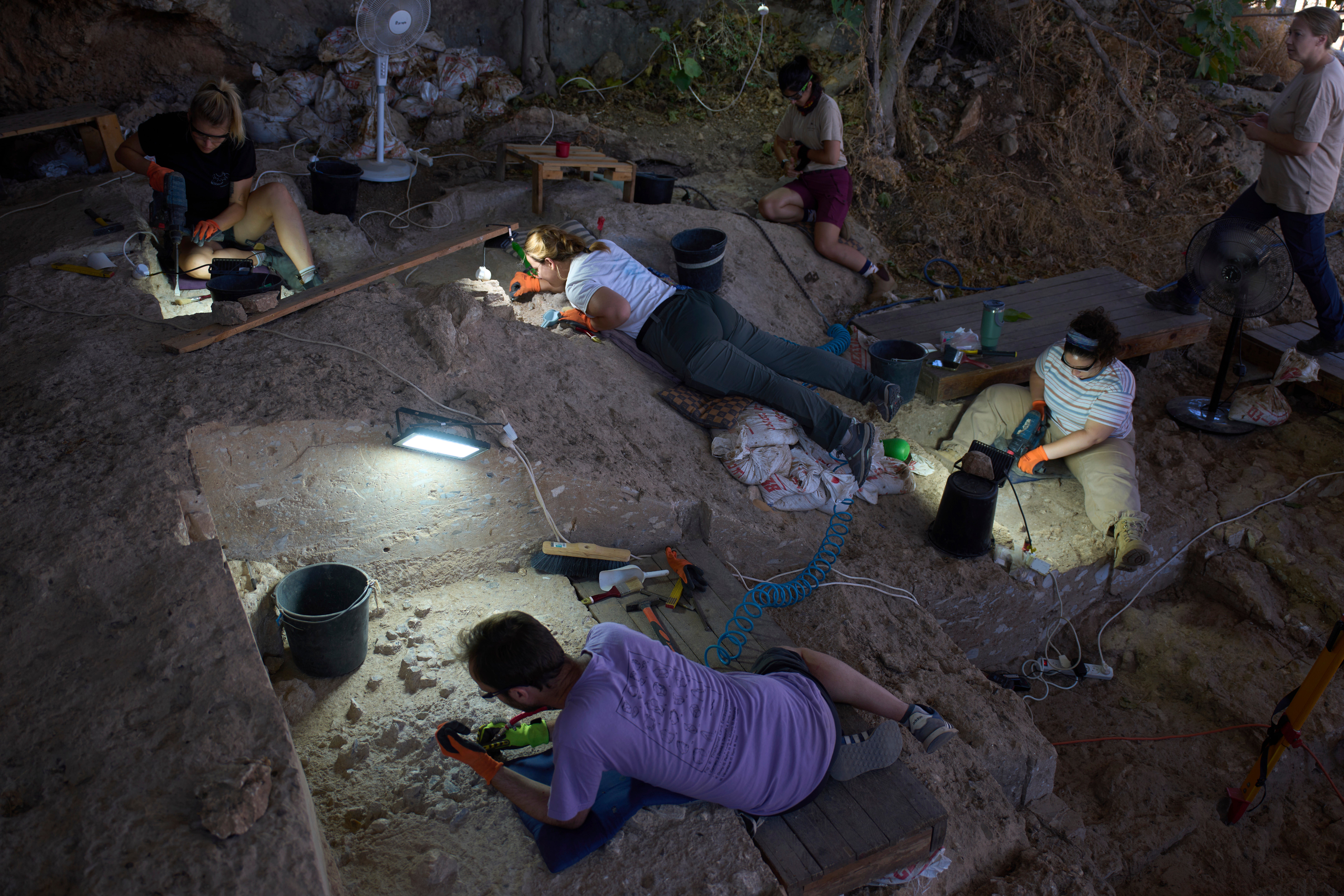 Volunteers excavating some of the remains in the cave
