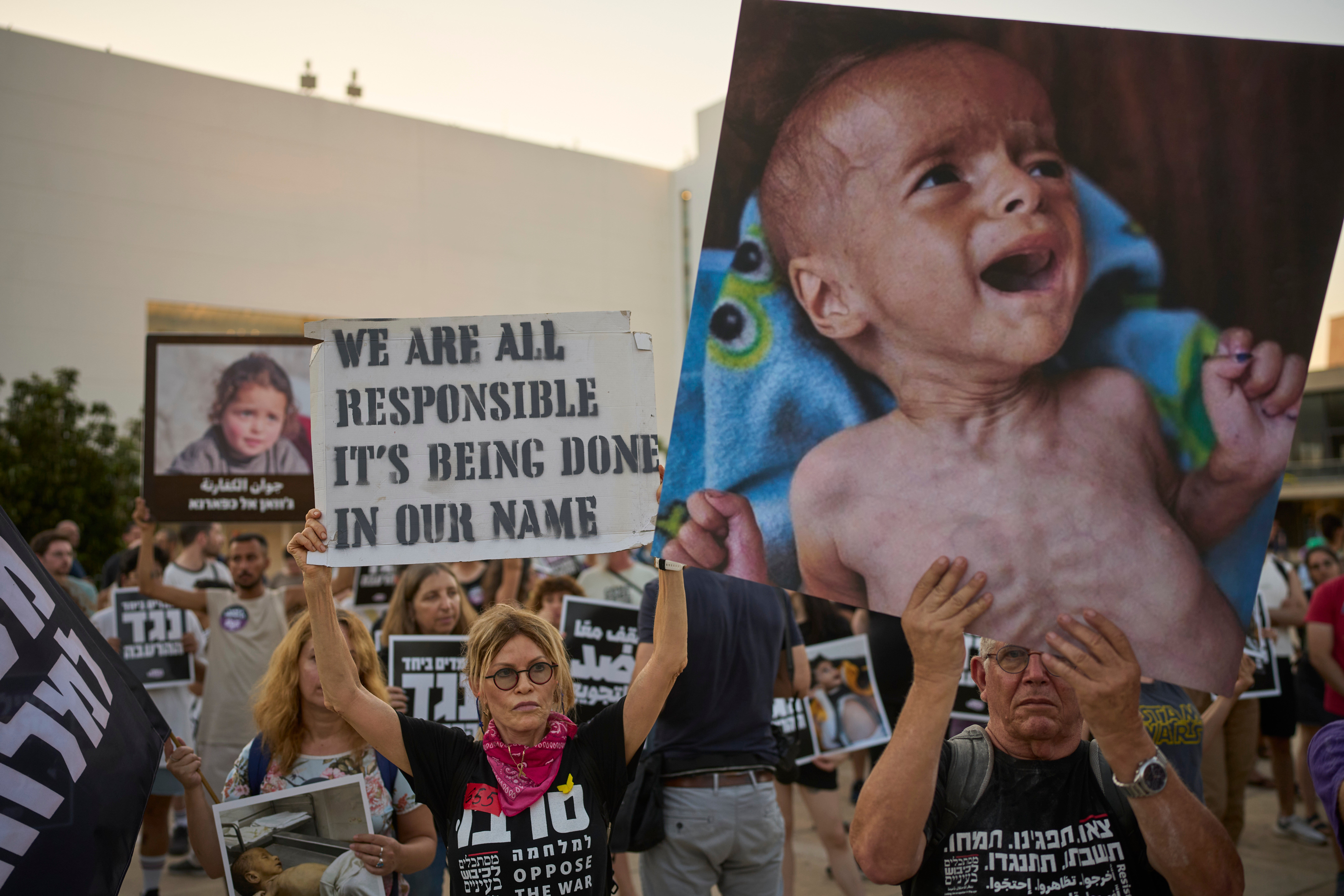 Israeli activists take part in a protest against the war in the Gaza Strip