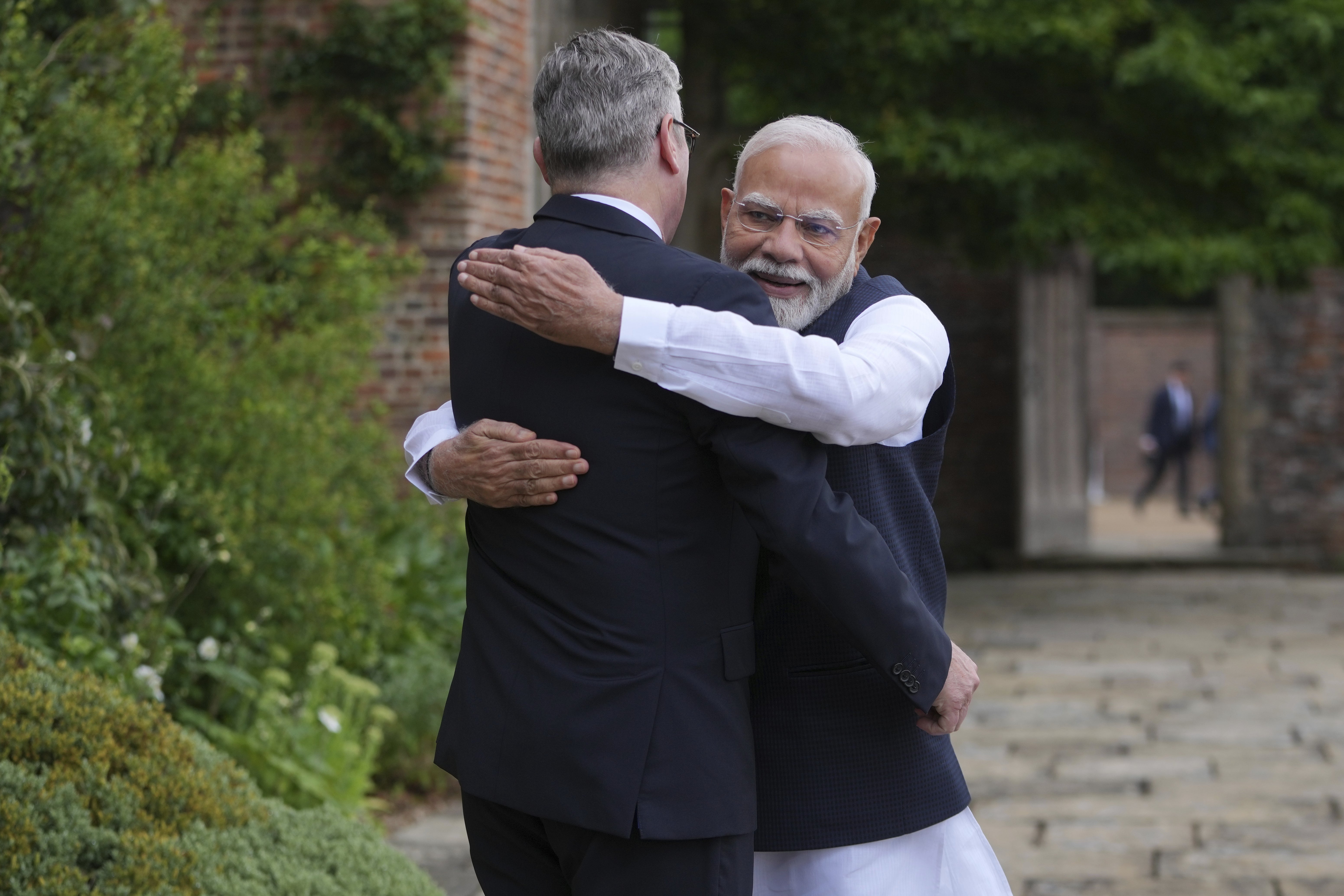 Prime Minister Sir Keir Starmer was embraced by Prime Minister of India Narendra Modi as they met at Chequers (Kin Cheung/PA)