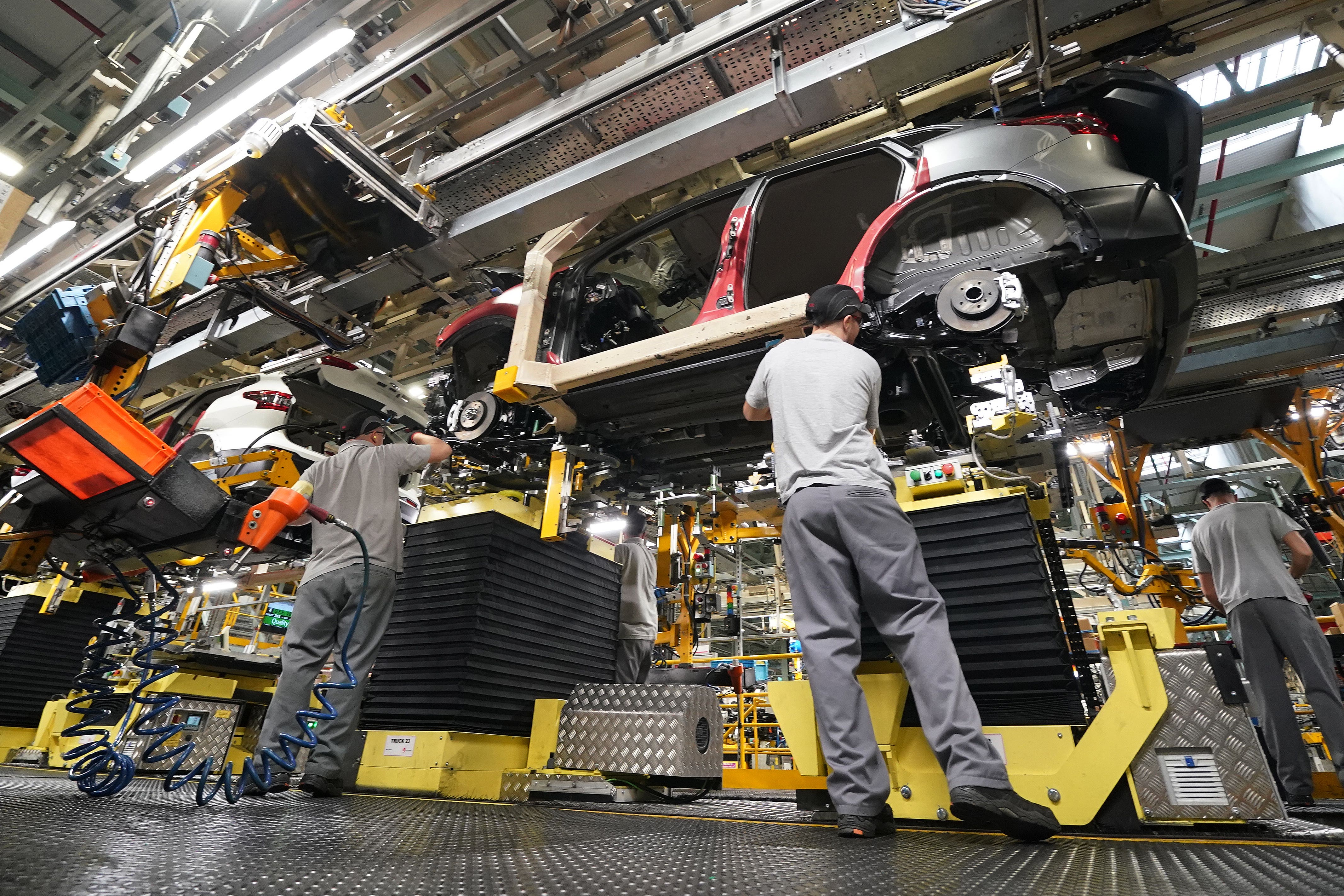 UK business growth slowed last month, according to new figures (Owen Humphreys/PA)