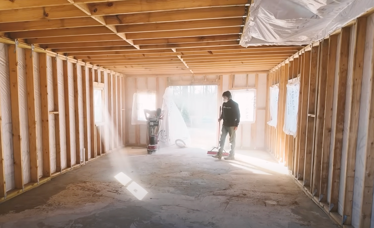 A frame house under construction at Return to the Land's Arkansas site