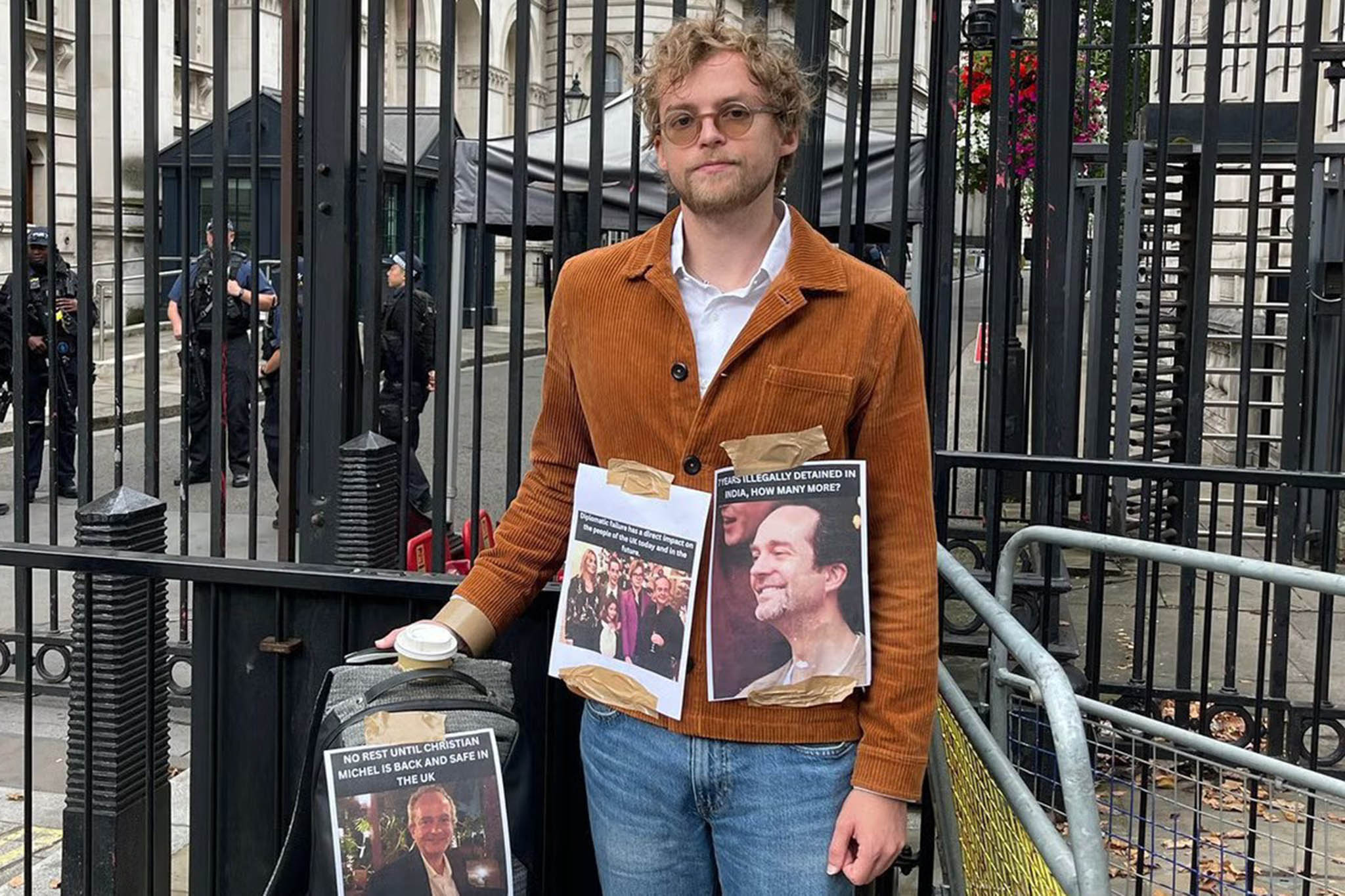 Alois Christian Michel, 27, protests outside Downing Street over the detention of his father Christian Michel in India