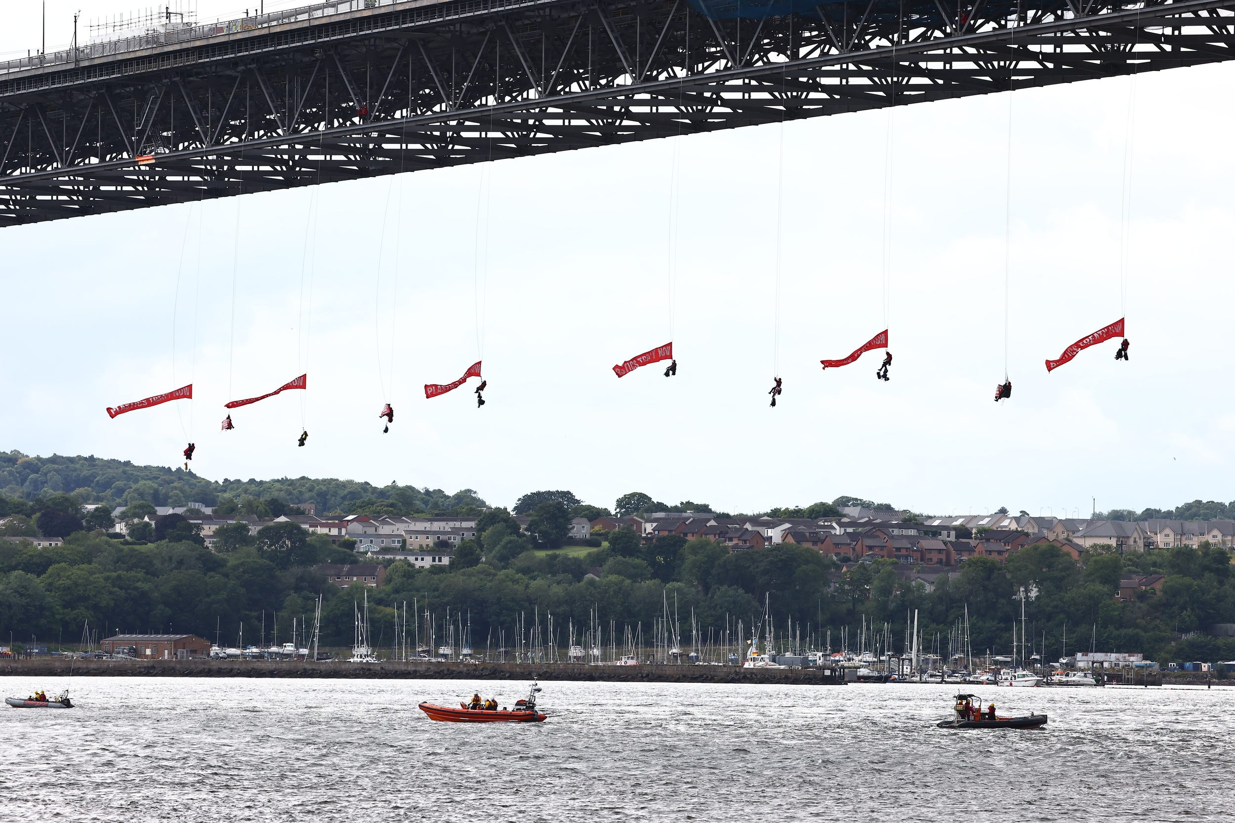 Ten activists suspended themselves from the bridge (Greenpeace/PA)