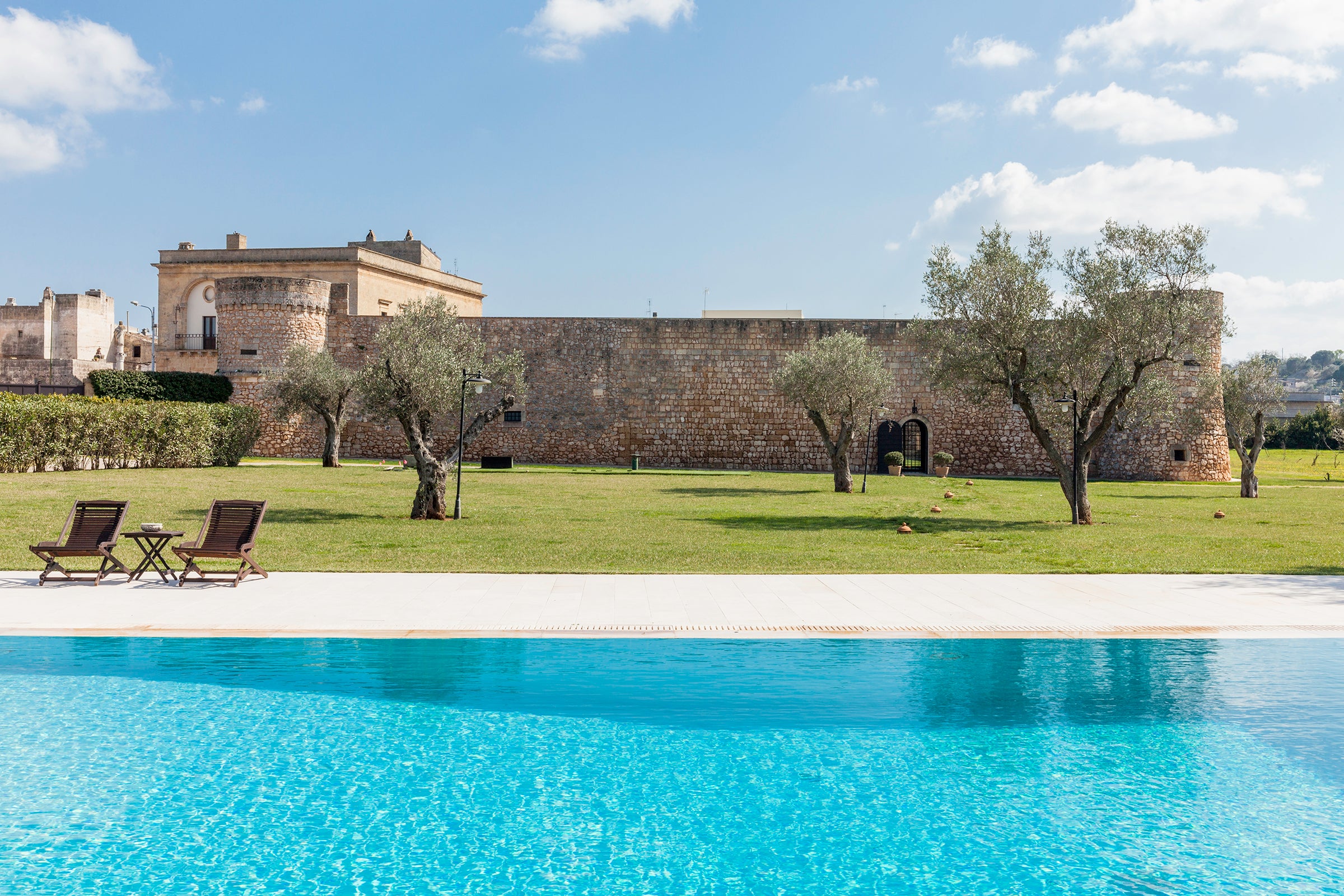High fortified walls are a notable feature of Castello di Caprarica