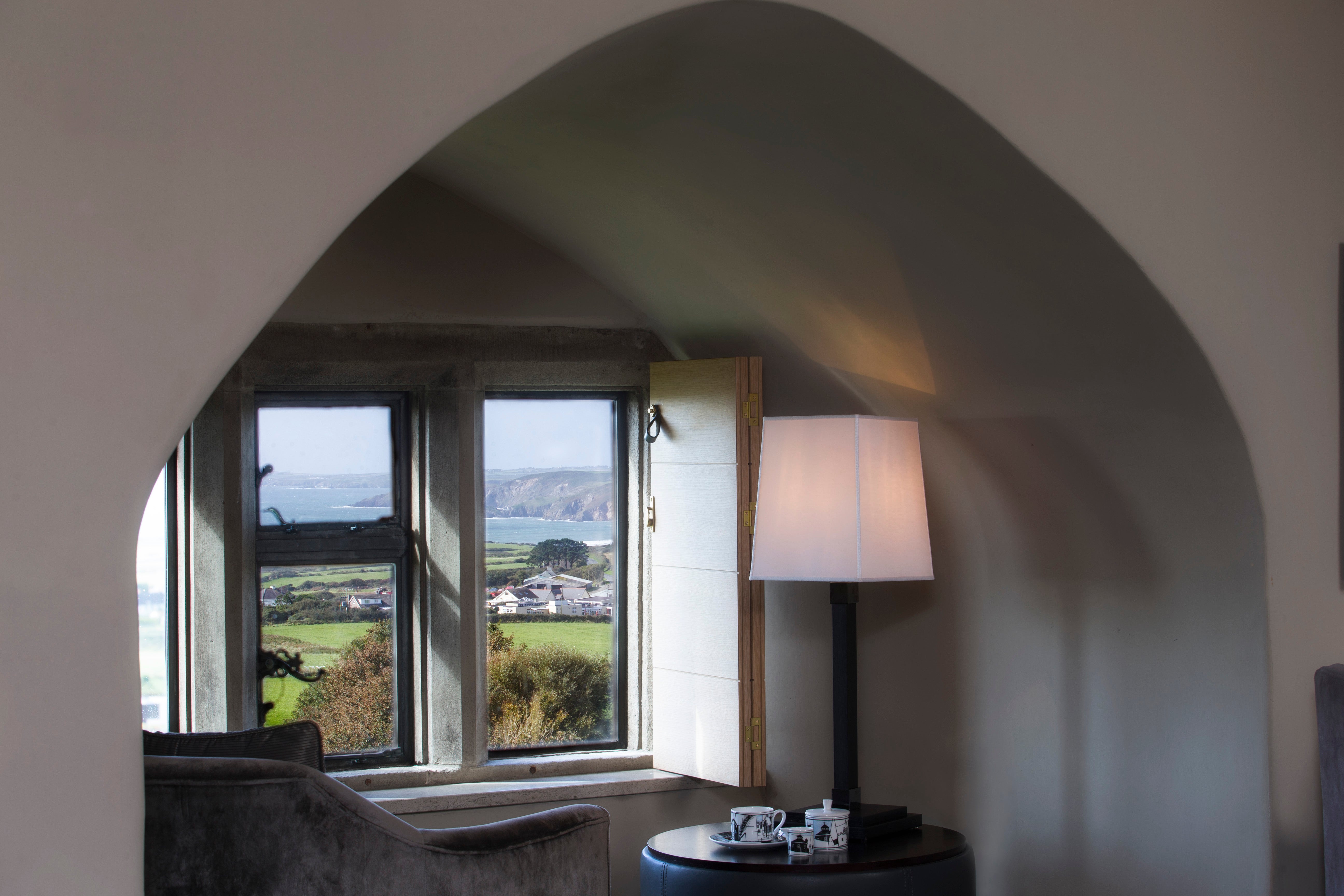 A bedroom view of St Brides Bay at Roch Castle