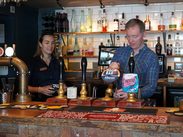 Political pint-pulling: tourism minister Chris Bryant spreading joy with Doom Bar
