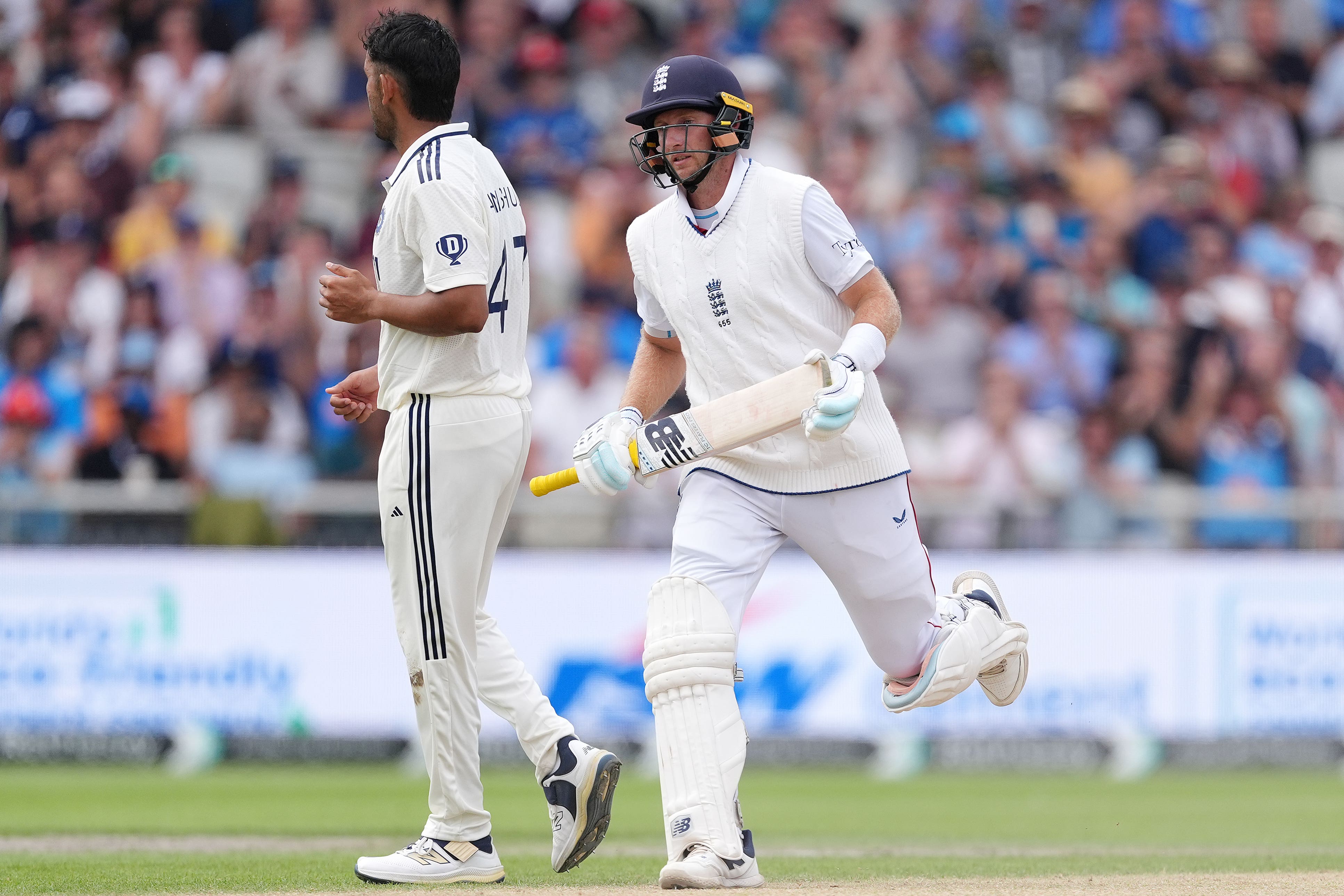 England’s Joe Root, right, runs his 13,379th Test run (Martin Rickett/PA)