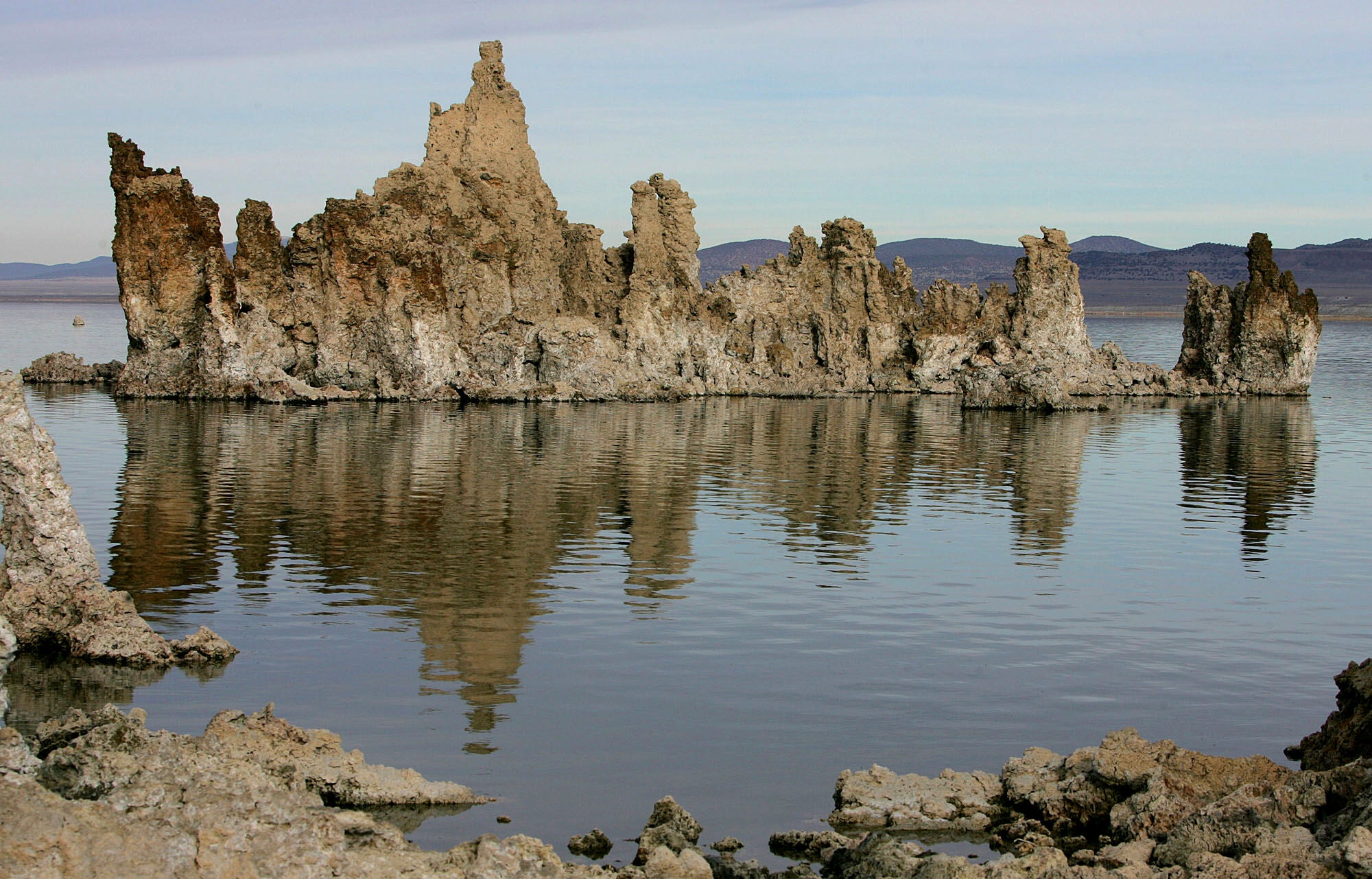 FILE - Tufa towers are reflected in Mono Lake near Lee Vining, Calif., Nov. 15, 2004. (AP Photo/Ben Margot, File)