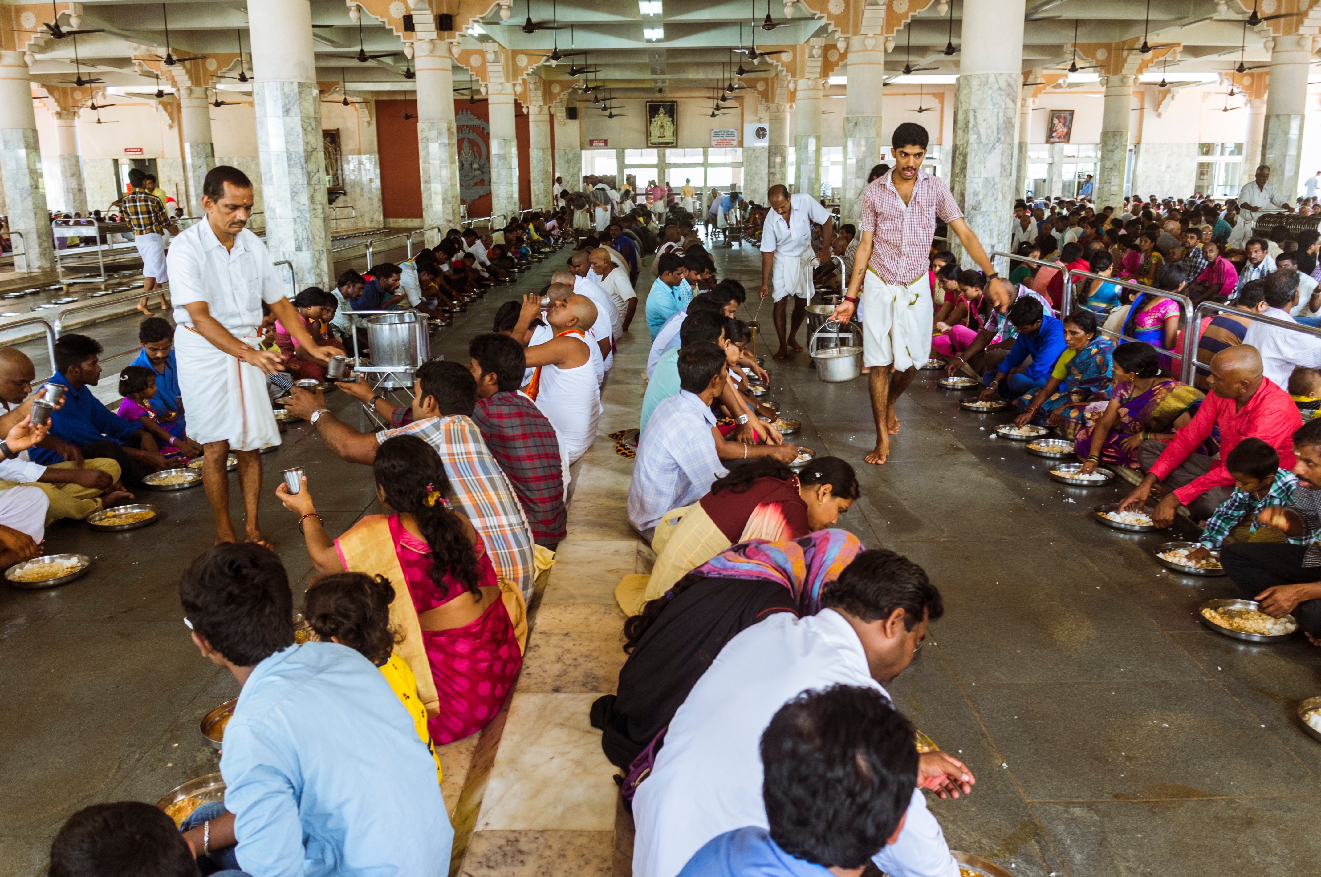 Food being served to hundreds of pilgrims at the Manjunatha Temple kitchen. Around 10,000 pilgrims pass through the temple every day