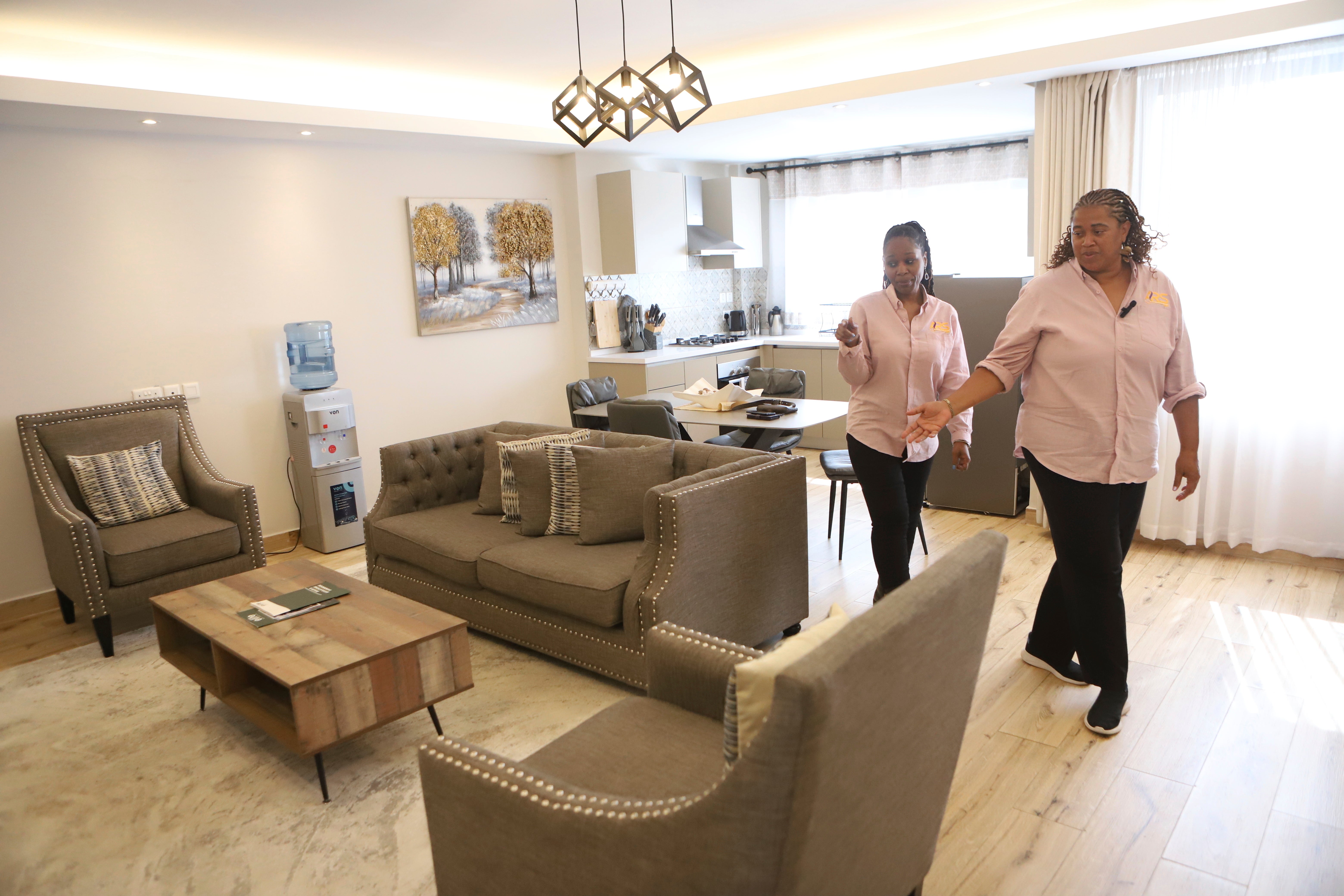 Adilah Relocation Services CEO and founder Adilah Muhammad, right, and administrative assistant Sharifa Martin inspect an apartment for a client relocating from the U.S. to Kenya, in Nairobi, Kenya, Friday, May 23, 2025. (AP Photo/Andrew Kasuku)