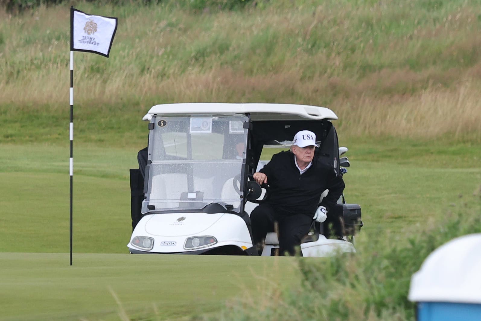 Hundreds protest Trump’s visit to Scotland as US president hits the golf course under heavy security