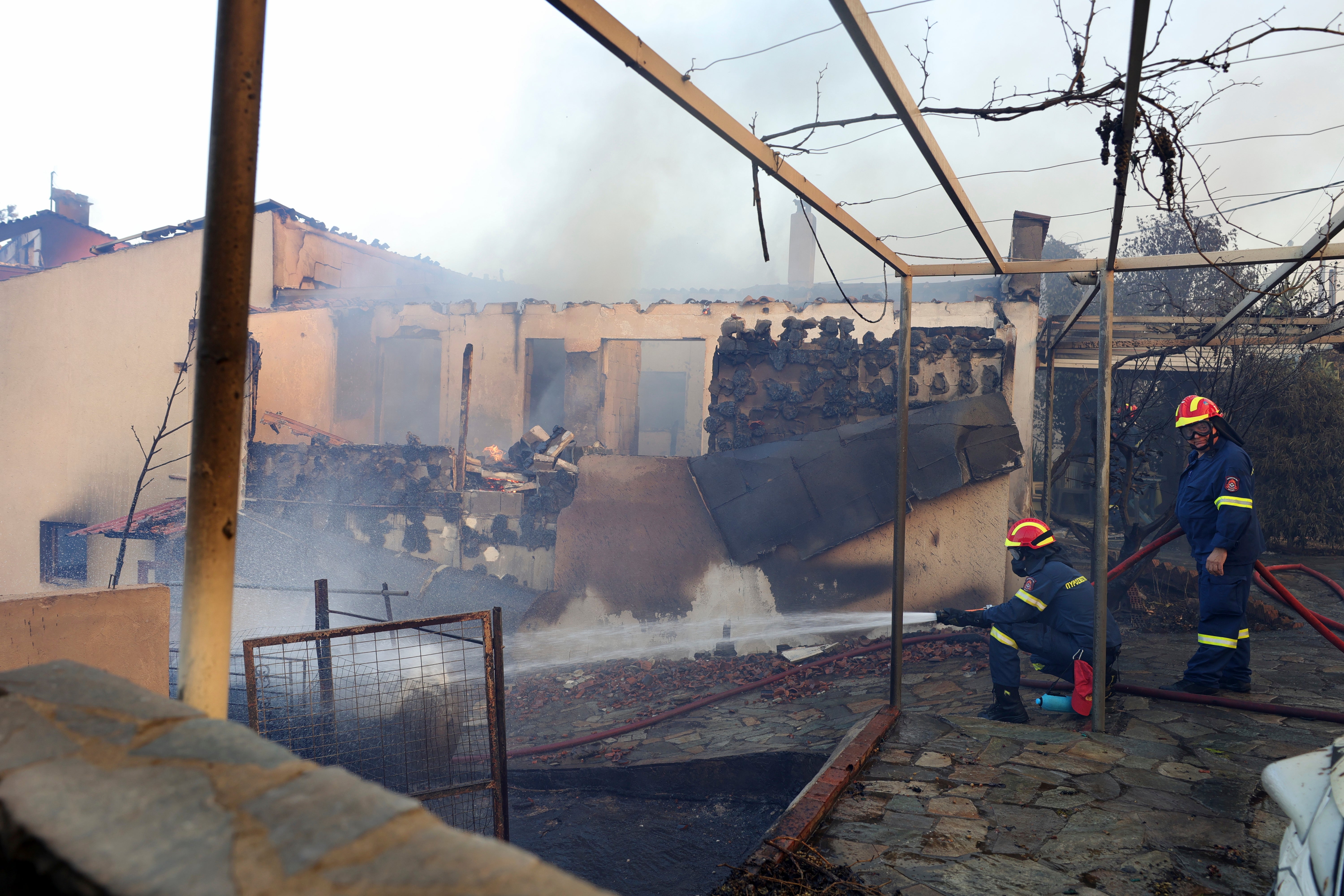 Wildfire burns through northern suburb of Greece's capital Athens and residents are told to evacuate