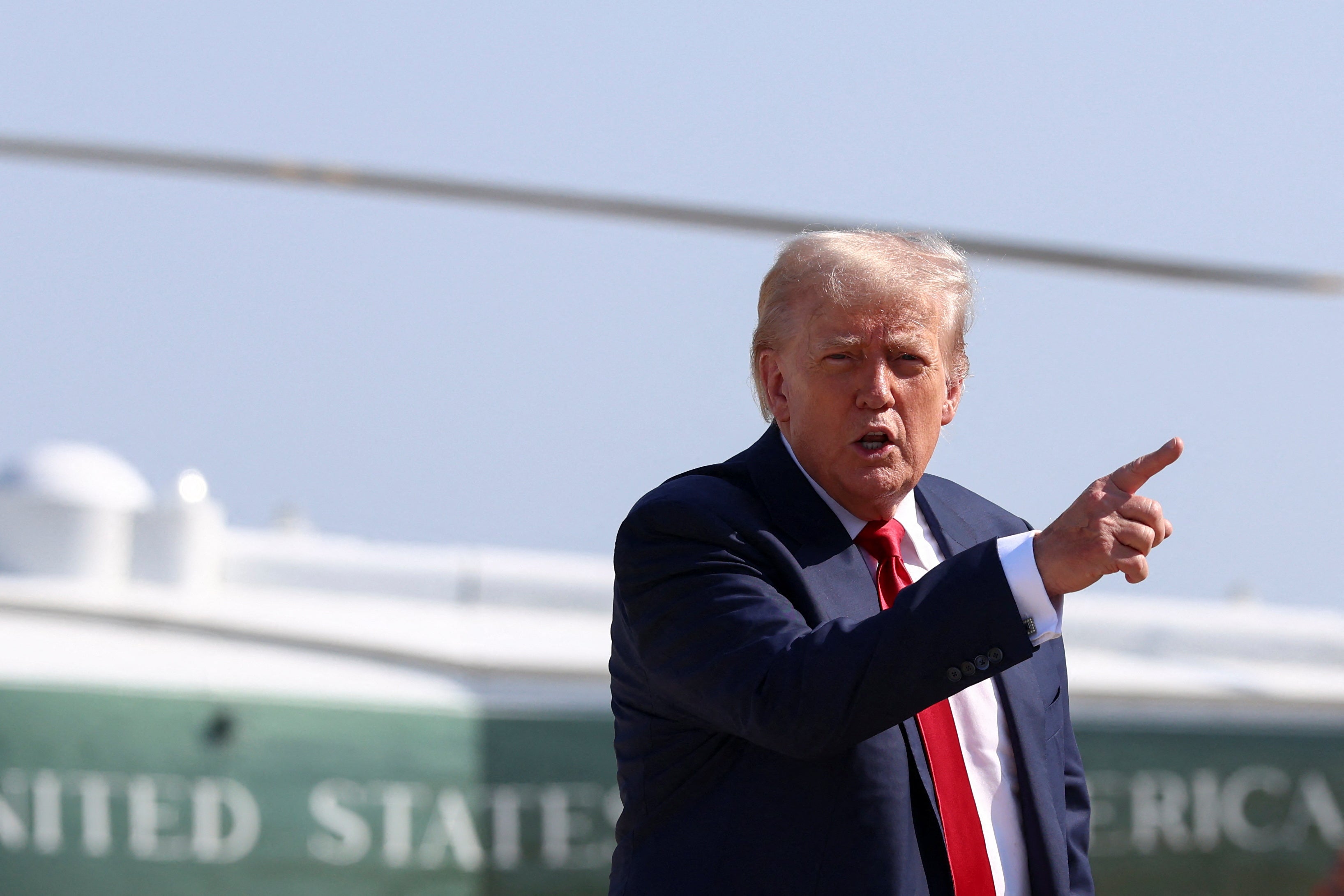 U.S. President Donald Trump gestures after disembarking Marine One, as he departs for Scotland, at Joint Base Andrews, Maryland, U.S., July 25, 2025. REUTERS/Evelyn Hockstein REFILE - QUALITY REPEAT