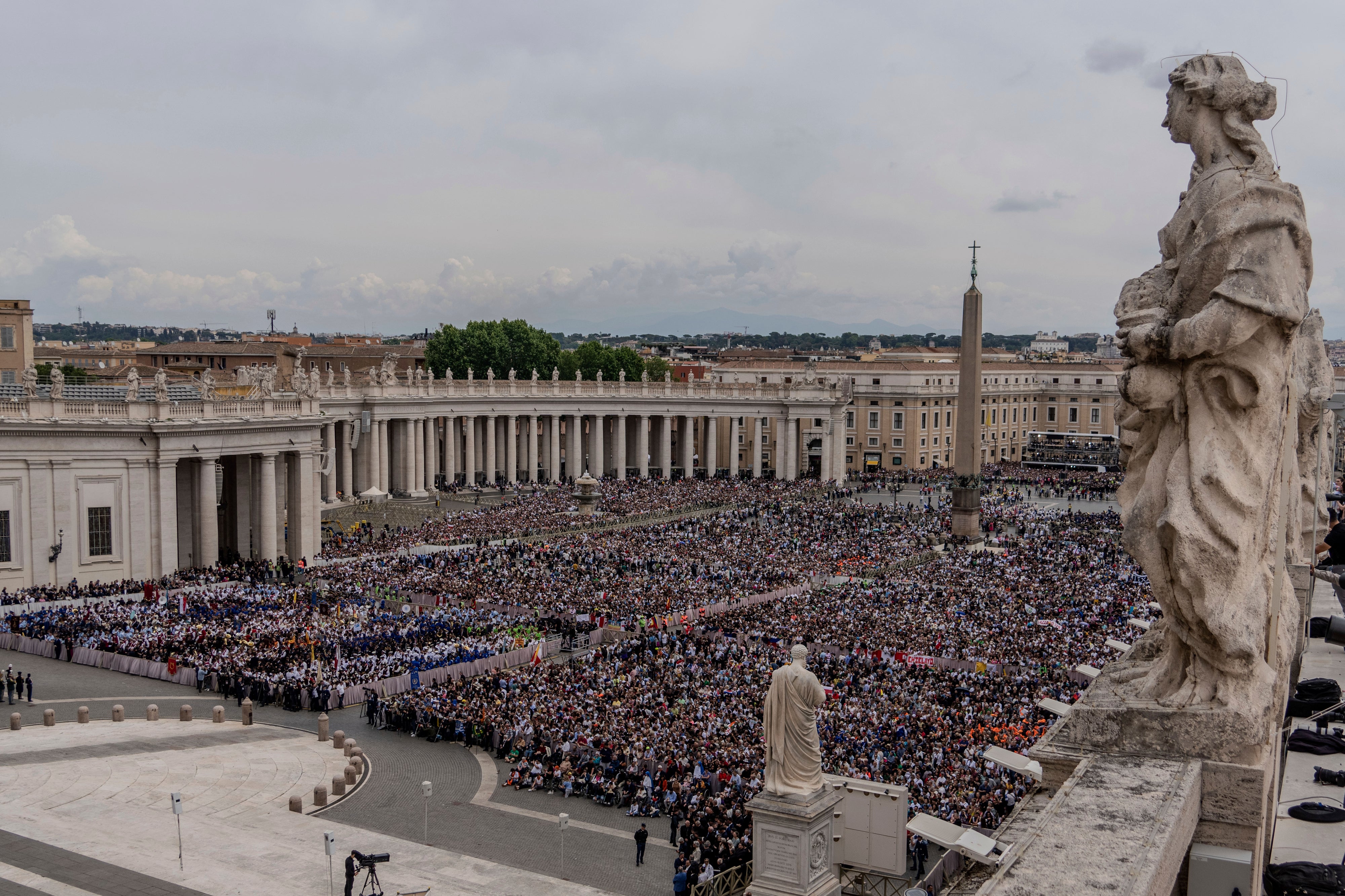 A crowd gathers in St. Peter's Square at the Vatican, where newly elected Pope Leo XIV will deliver a blessing from the central balcony of St. Peter's Basilica on Sunday, May 11, 2025. (AP Photo/Domenico Stinellis, File)