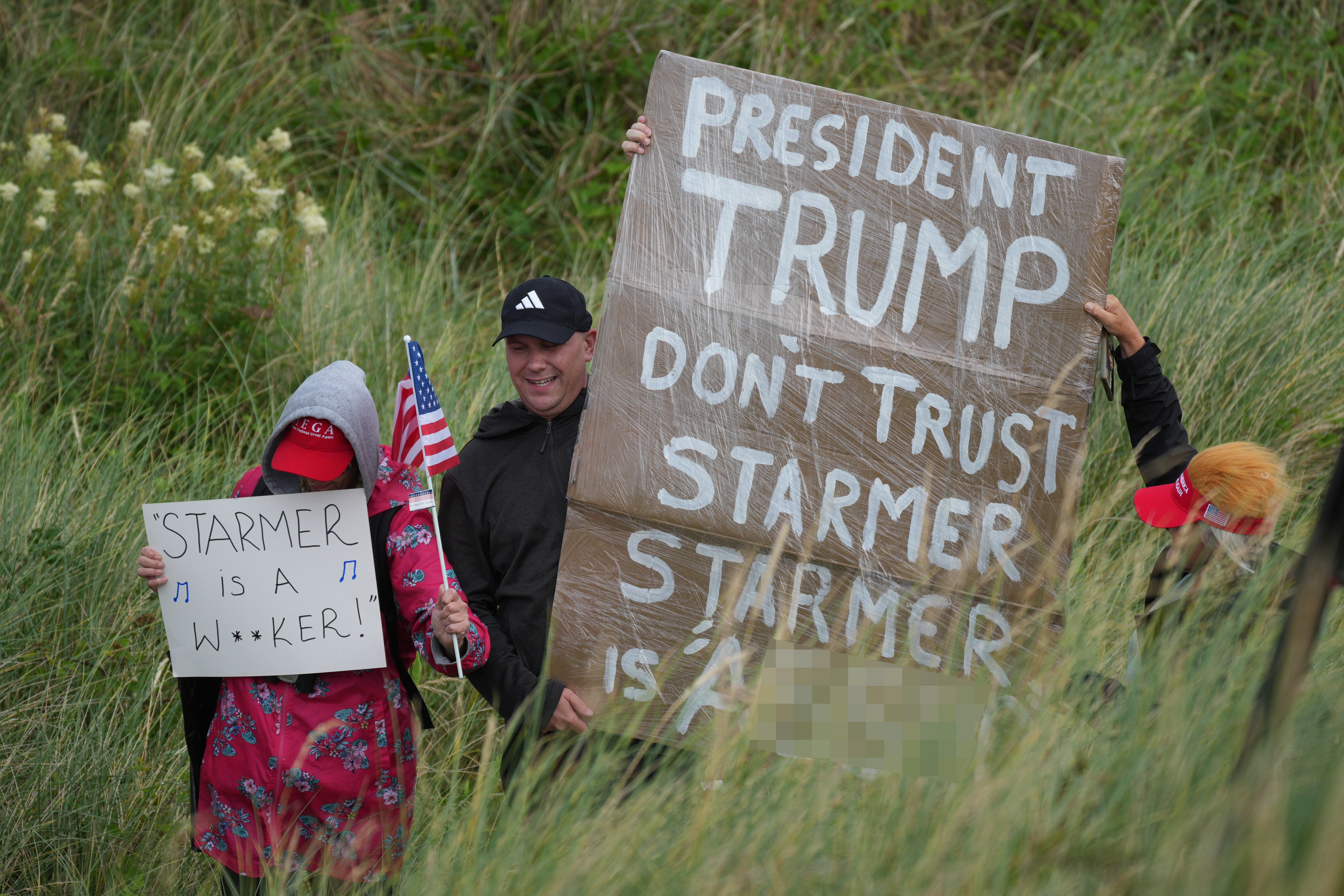 One placard read: “Starmer is a w****r”, while another said: “Starmer is a**ho”.
