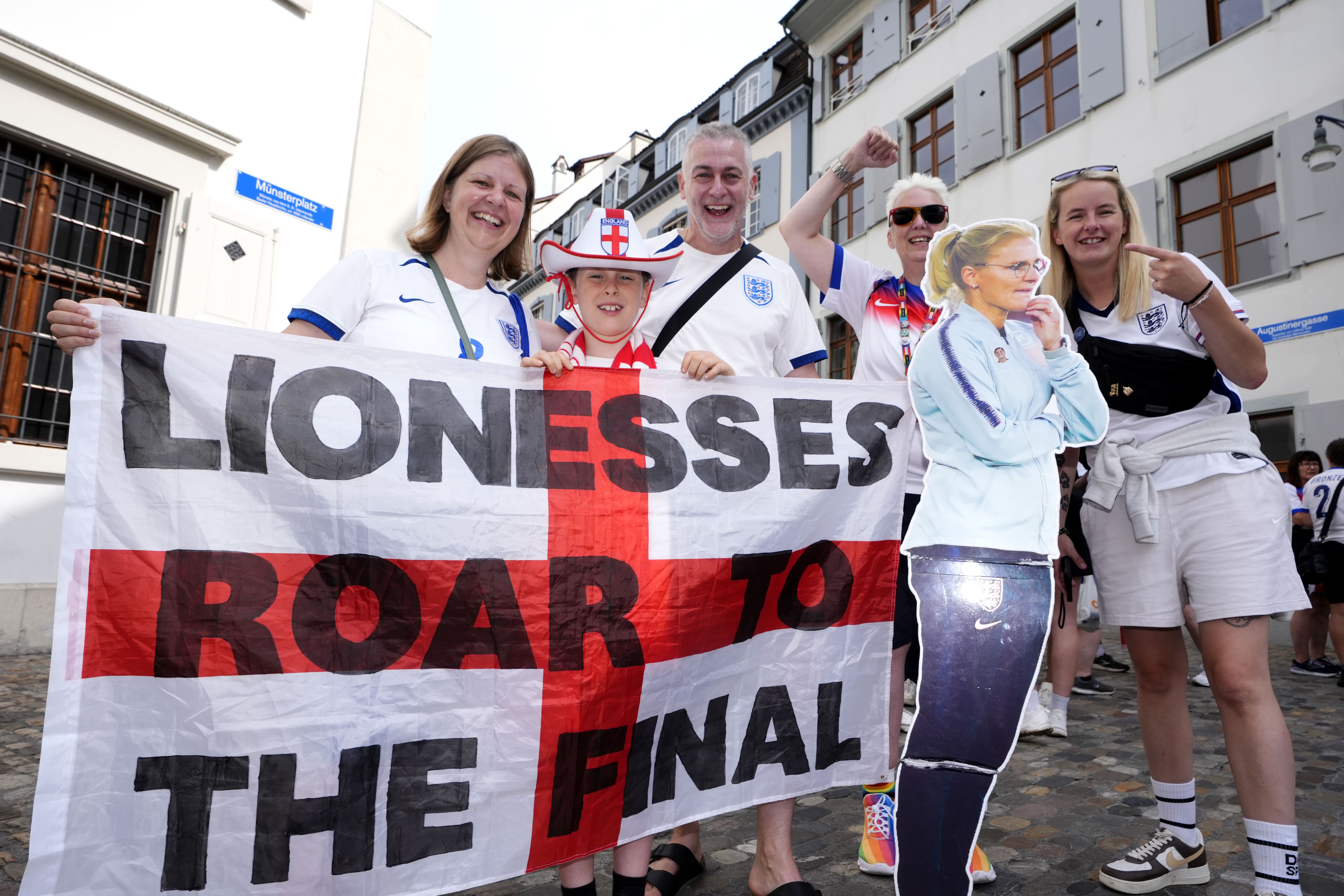 England fans pose for photographs with a cardboard cutout of England head coach Sarina Wiegman (Nick Potts/PA)