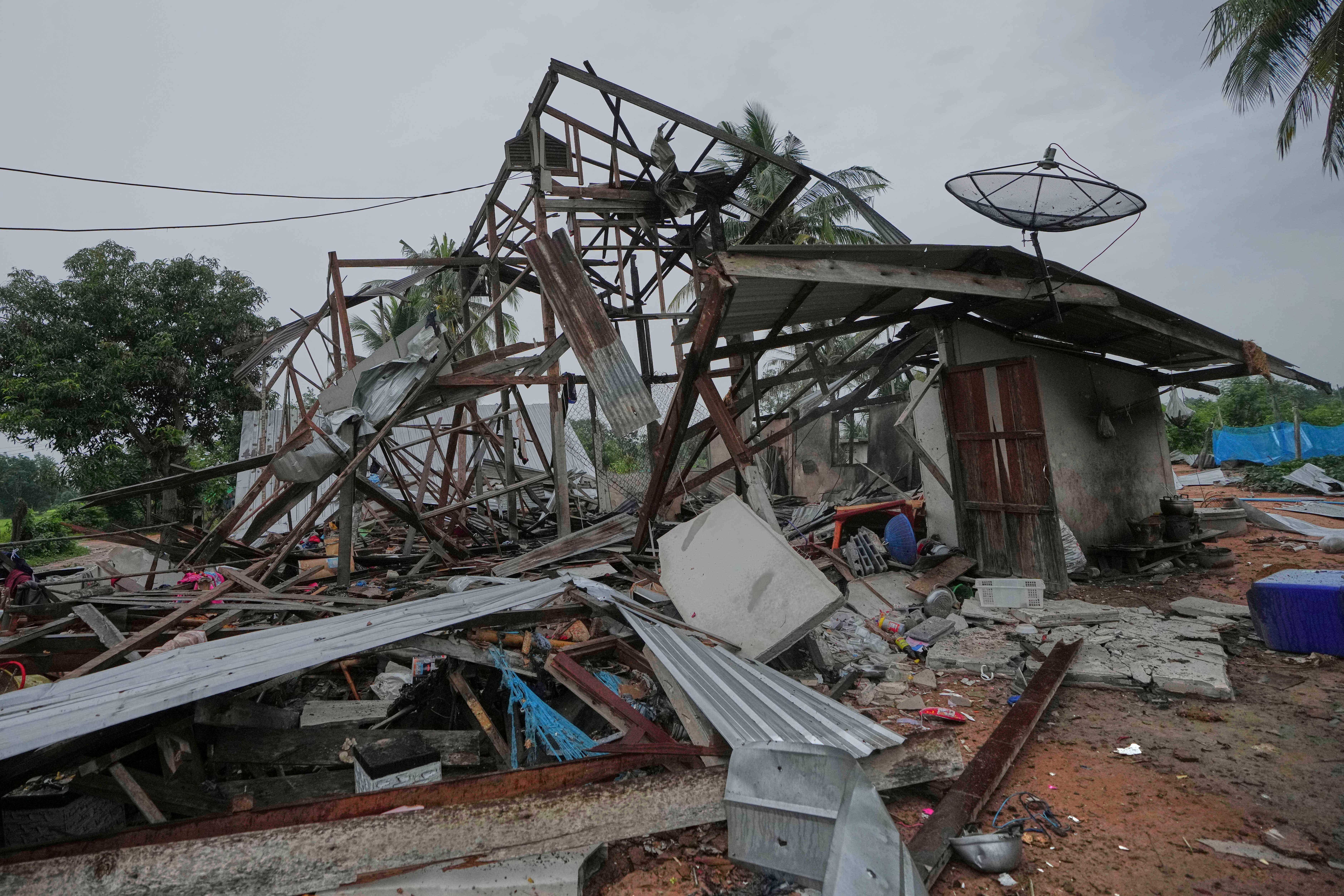 A house damaged by a Cambodia artillery shell in Surin province of Thailand