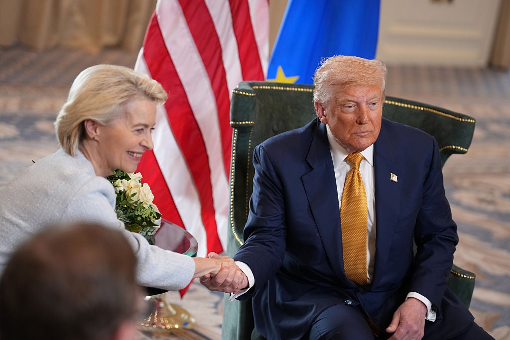 Donald Trump shakes the hand of European Commission president Ursula von der Leyen Sunday. He announced a trade deal had been reached with the European Union later in the day.