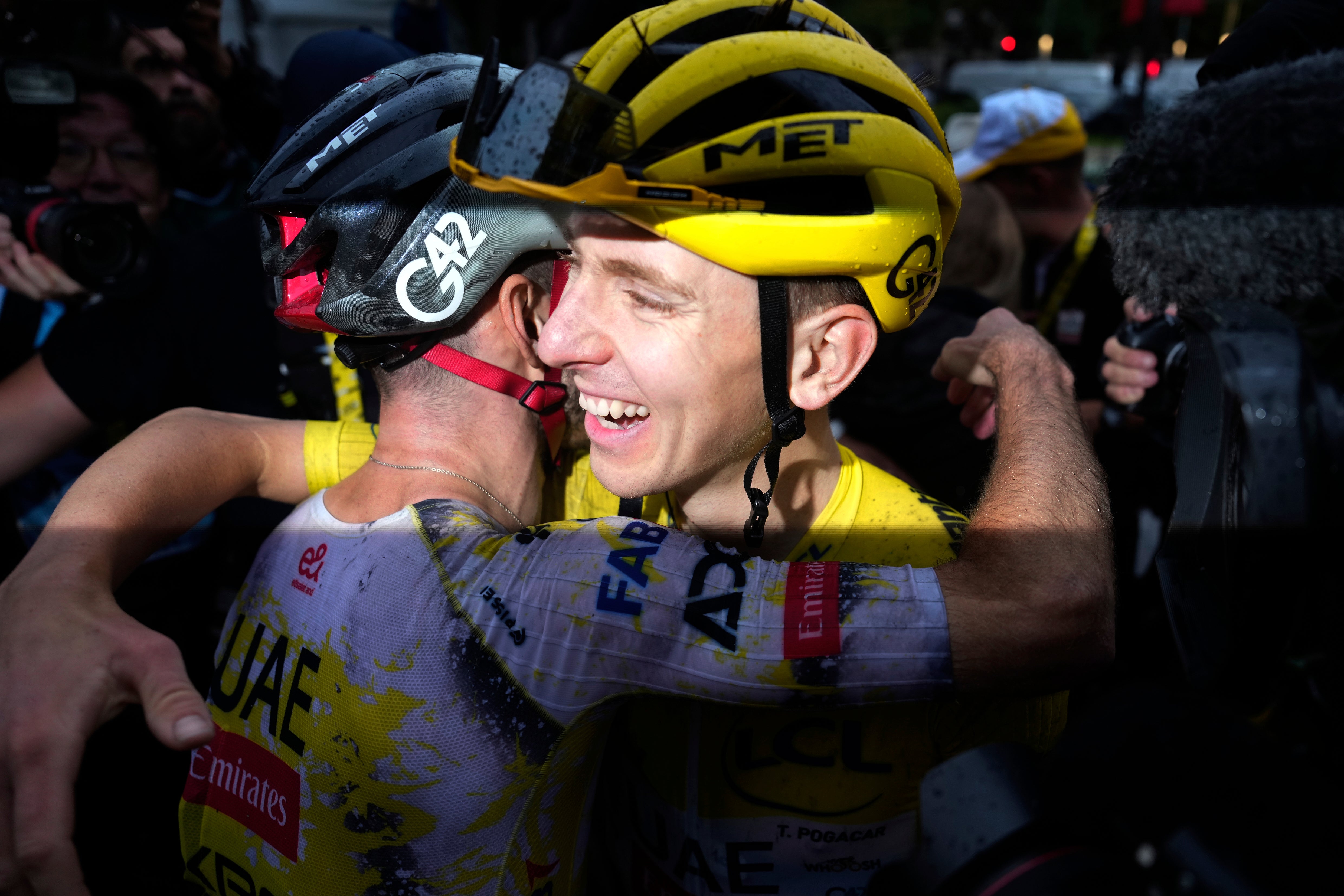 Tadej Pogacar celebrated with his teammates after safely finishing the race