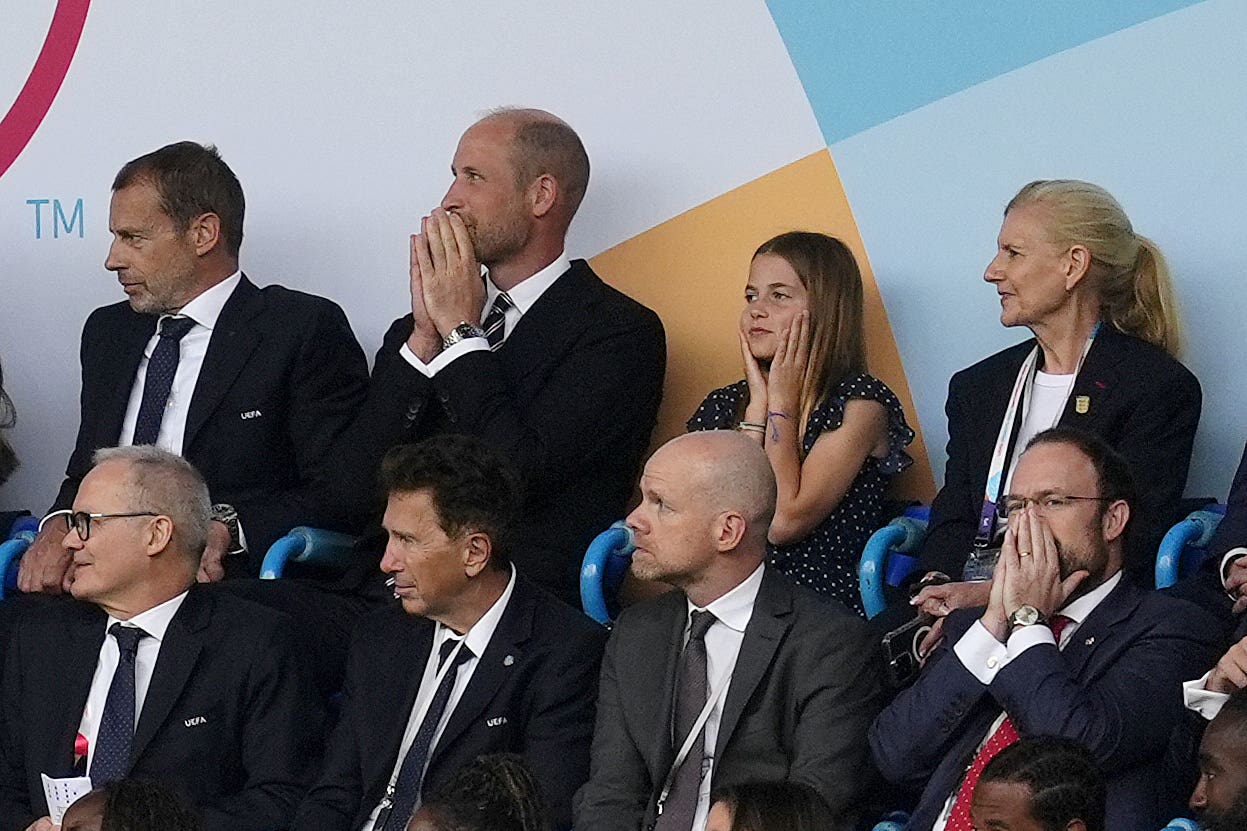 The Prince of Wales, centre left, and Princess Charlotte react as Spain’s Mariona Caldentey scores