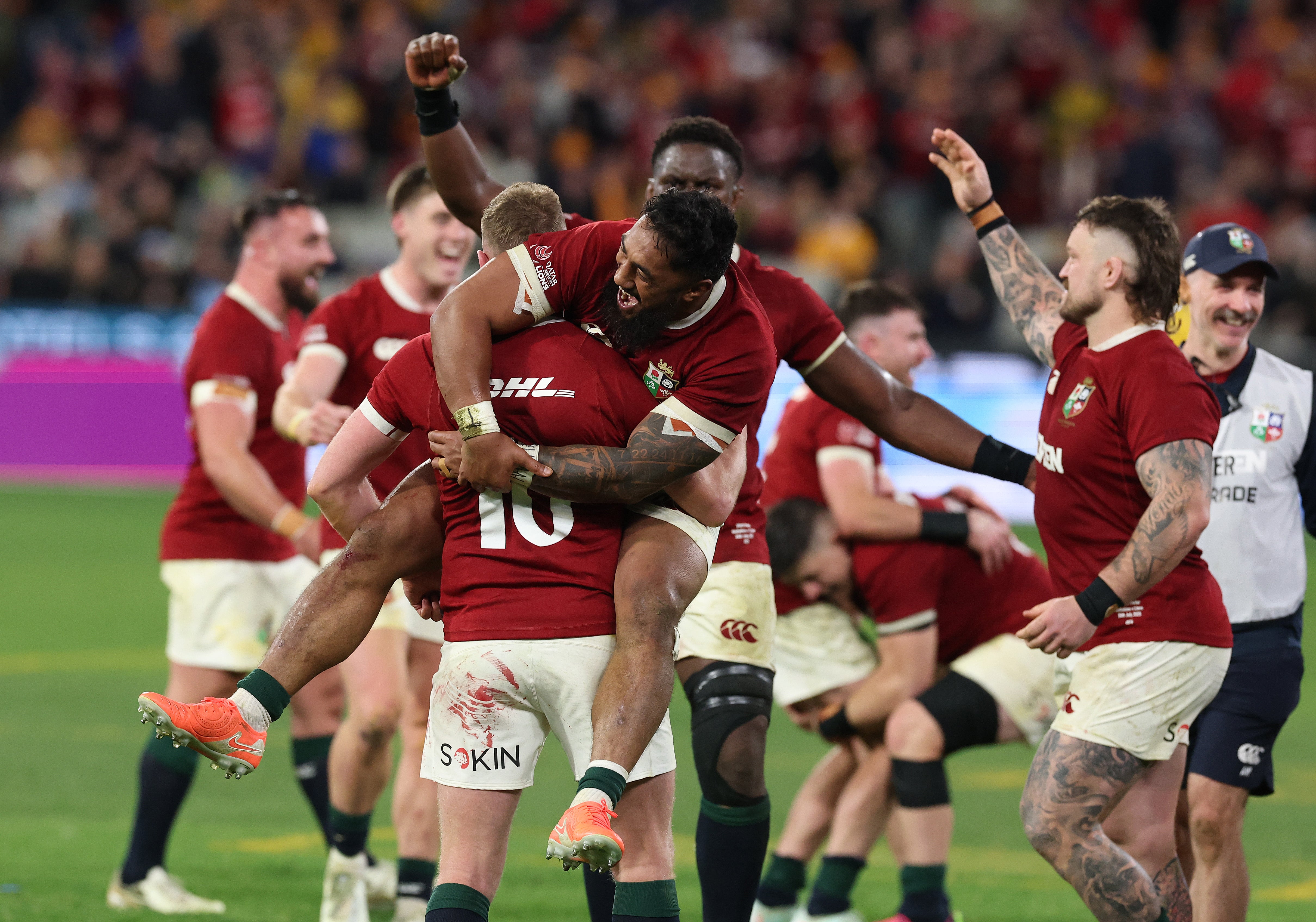 Finn Russell and Bundee Aki celebrate the Lions' series win