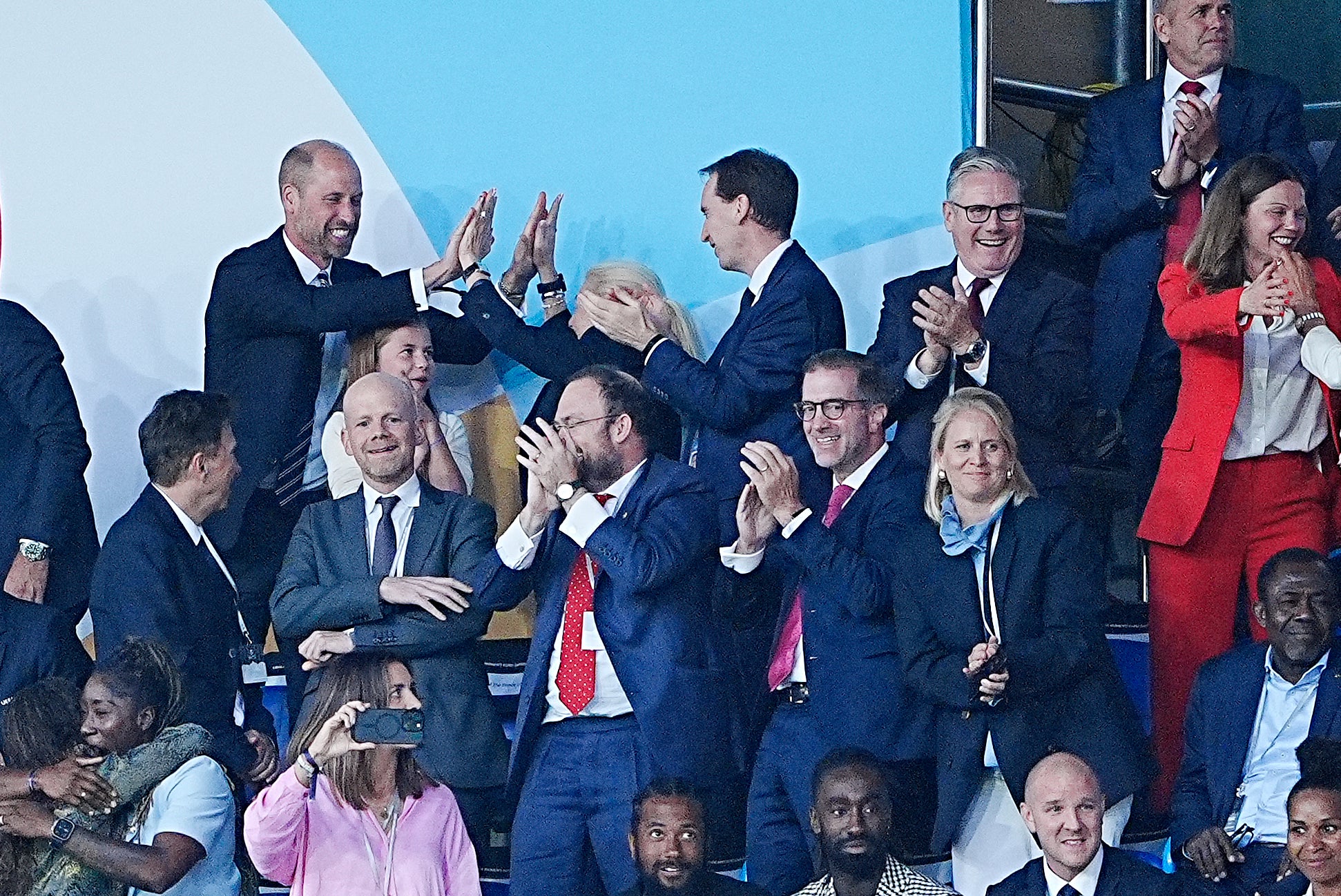 The Prince of Wales and Princess Charlotte, and FA Chair Debbie Hewitt celebrate after England's Chloe Kelly scored the winning penalty