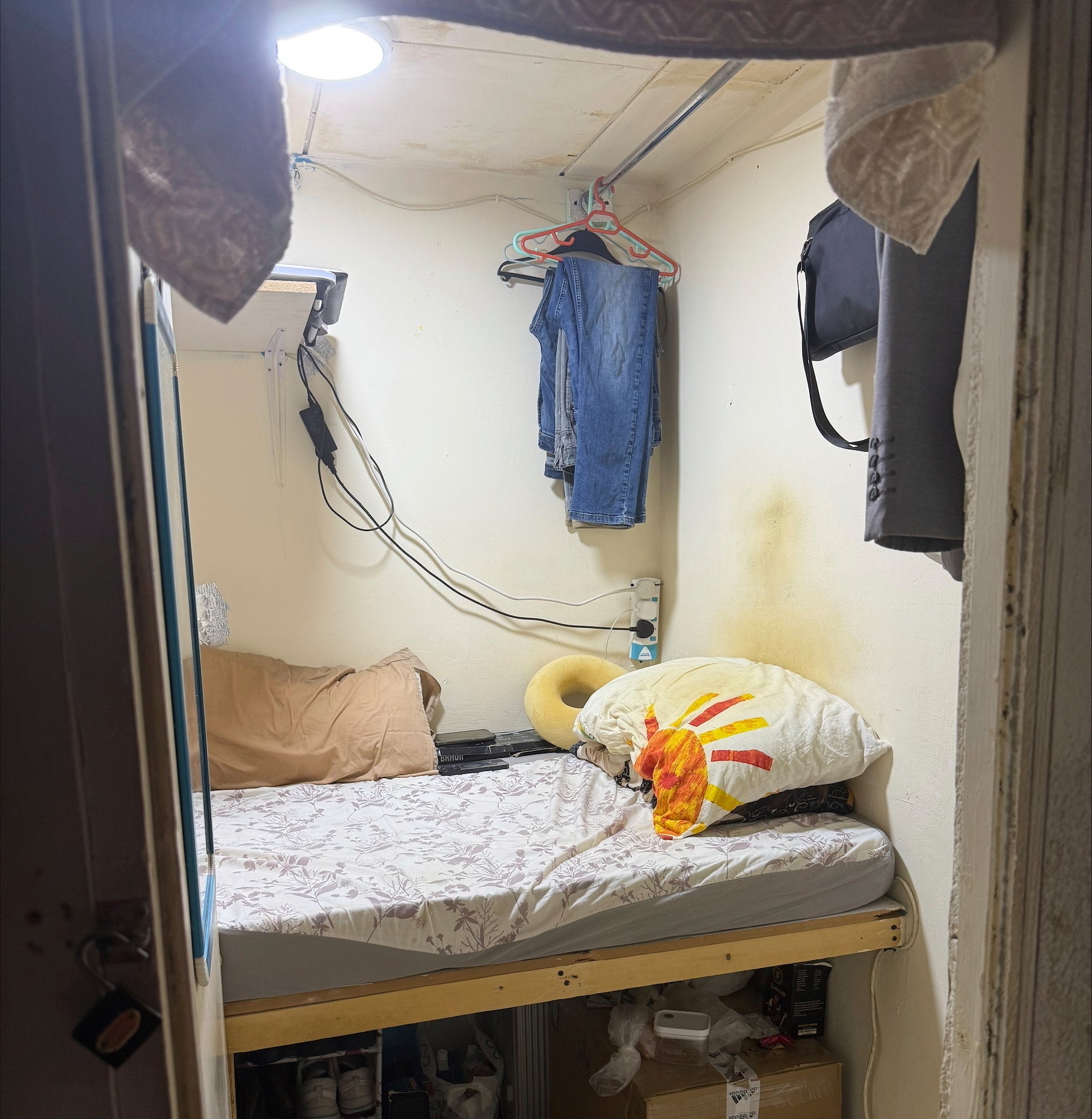 A modified closet where a migrant worker lives in Dubai, United Arab Emirates, is seen on Tuesday, July 8, 2025. (AP Photo/Gabe Levin)