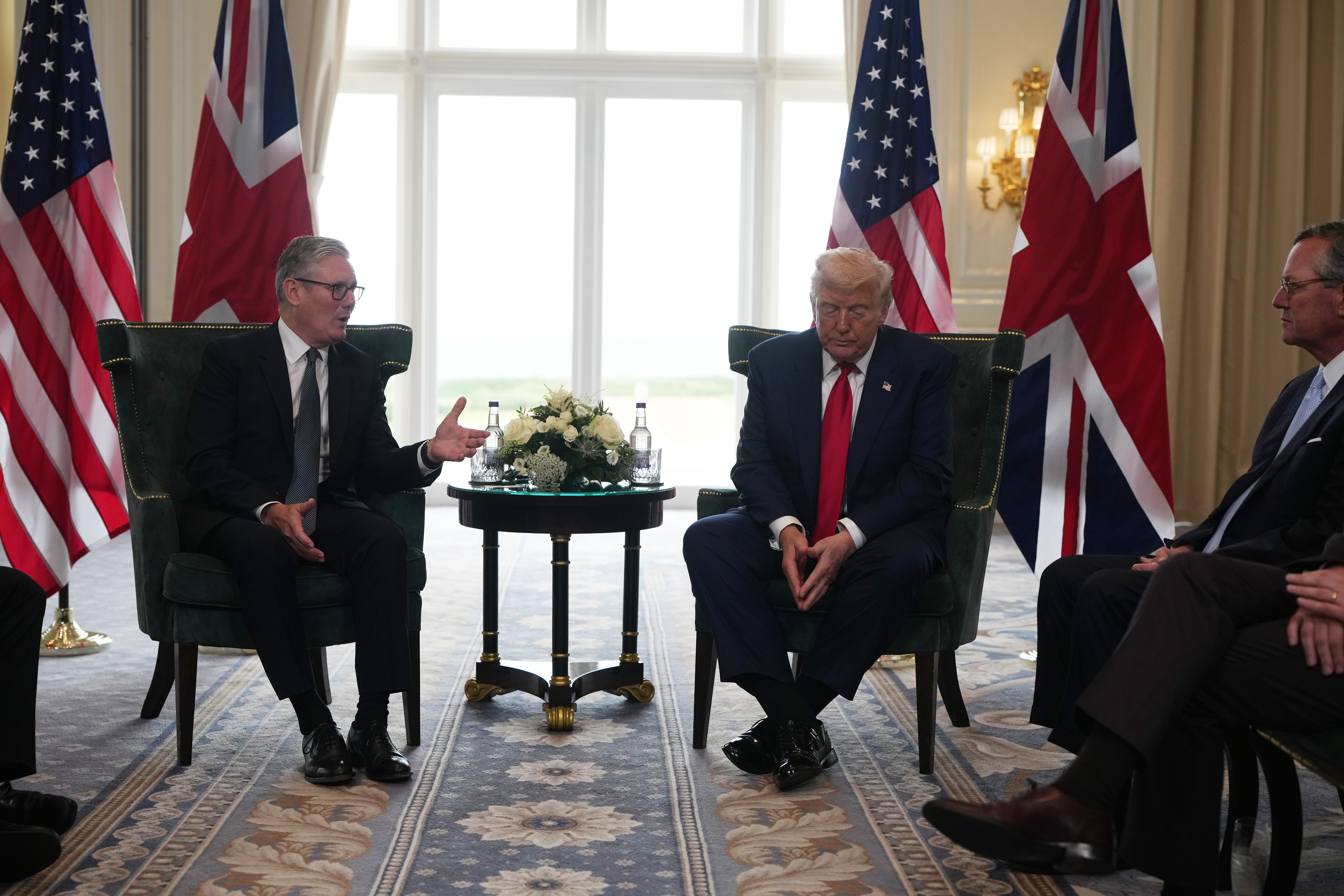 Sir Keir Starmer, left, chats to Donald Trump while the US ambassador to the UK, Warren Stephens, looks on (Chris Furlong/PA)