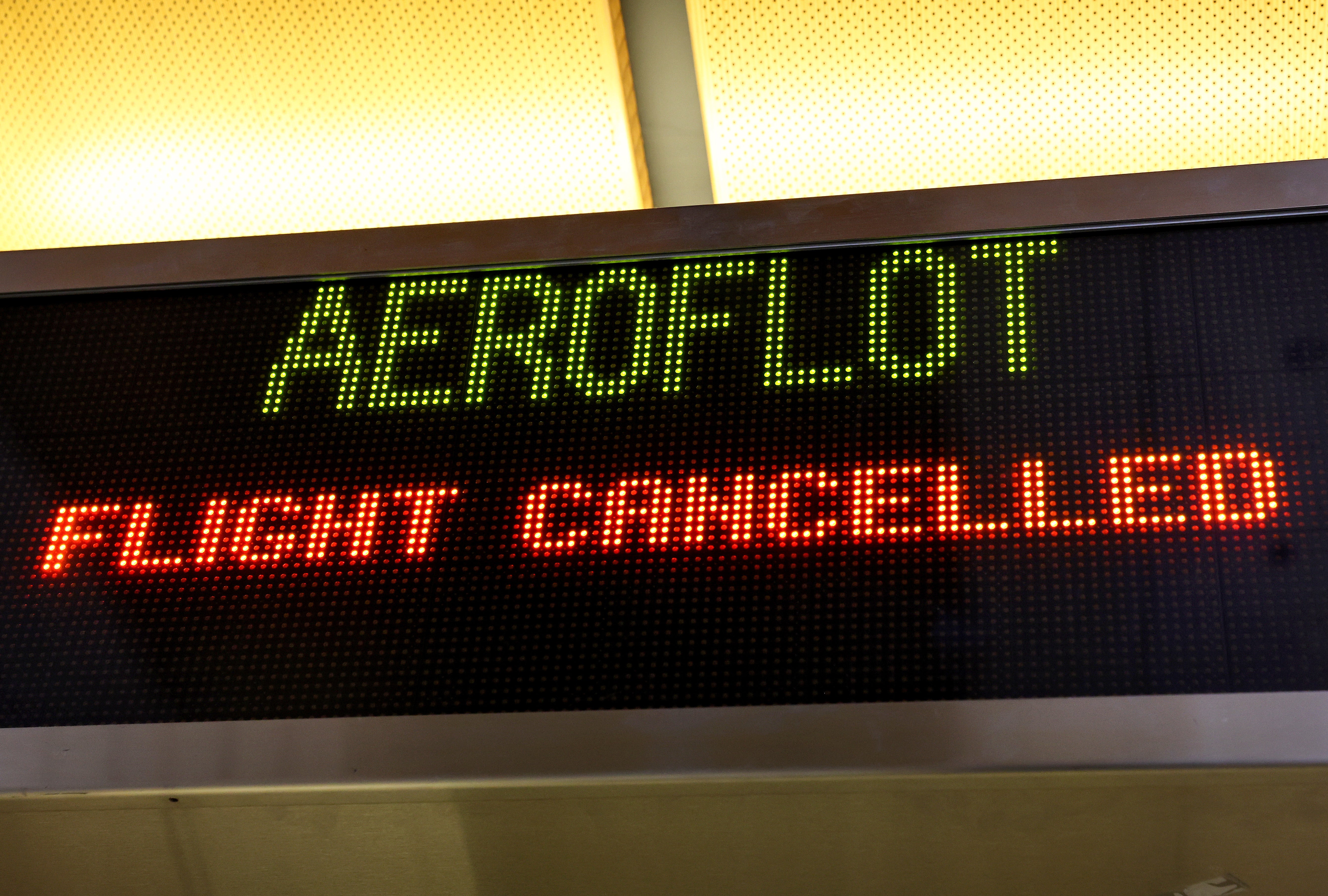 A sign reads 'Flight Cancelled' at the Aeroflot check-in counter in the Tom Bradley International Terminal at Los Angeles International Airport (LAX) on March 02, 2022