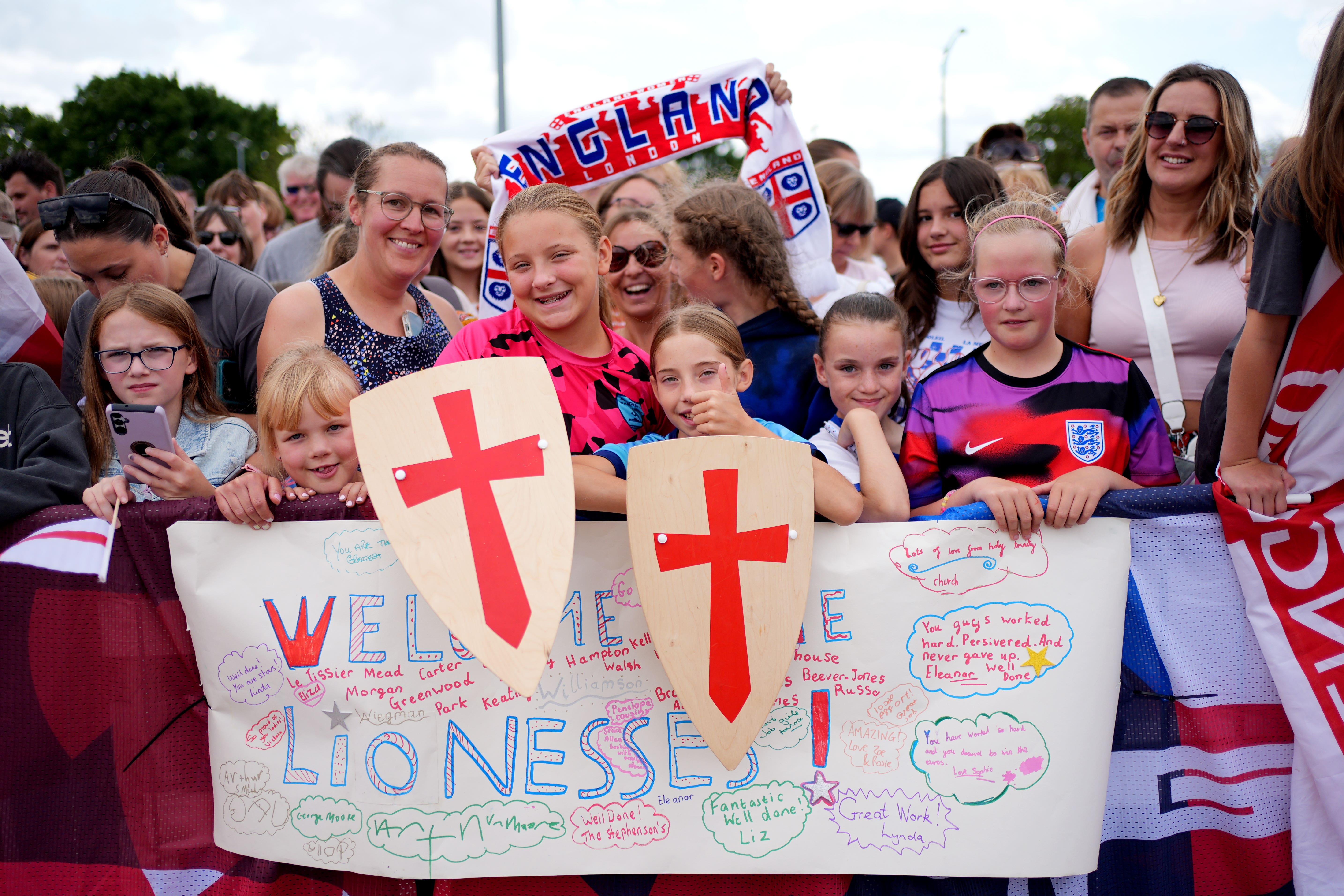 England fans waiting outside London Southend Airport for the England team to arrive (Yui Mok/PA)