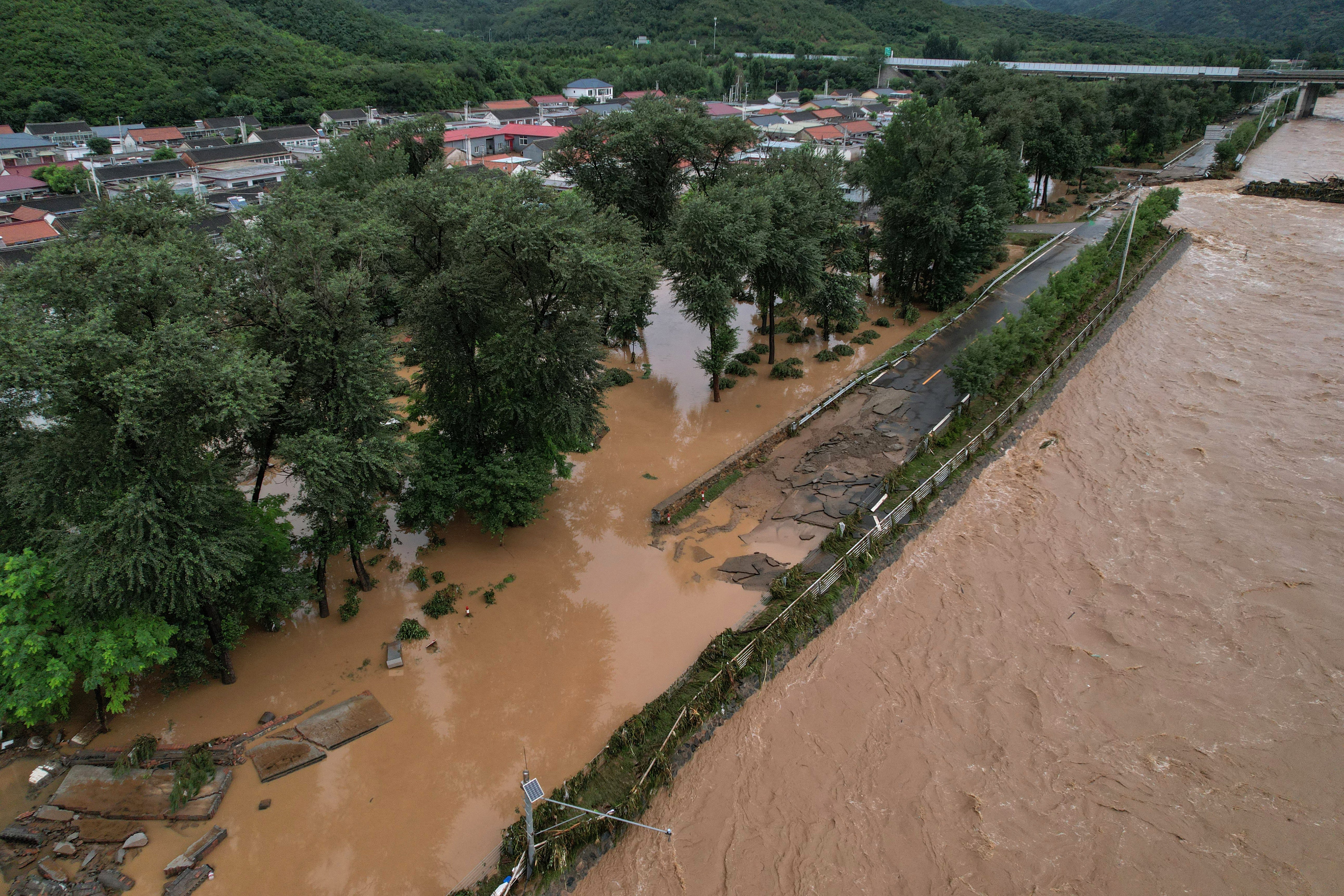 An aerial view shows a flooded area after heavy rain at Xin’anzhuang village in Miyun district on the outskirts of Beijing on 28 July 2025