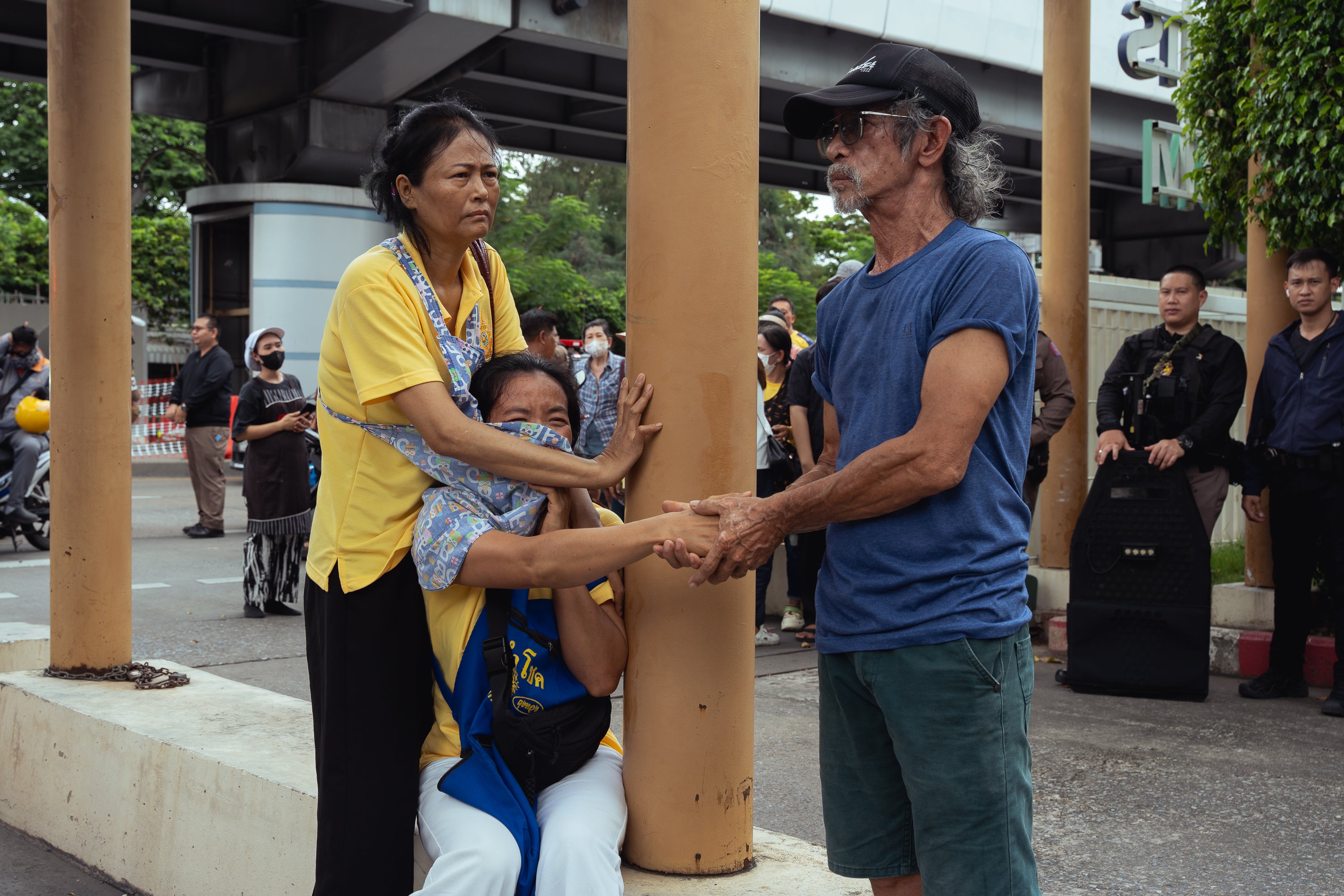 Onlookers are distraught by the shooting at Or Tor Kor wet market on July 28, 2025 in Bangkok, Thailand