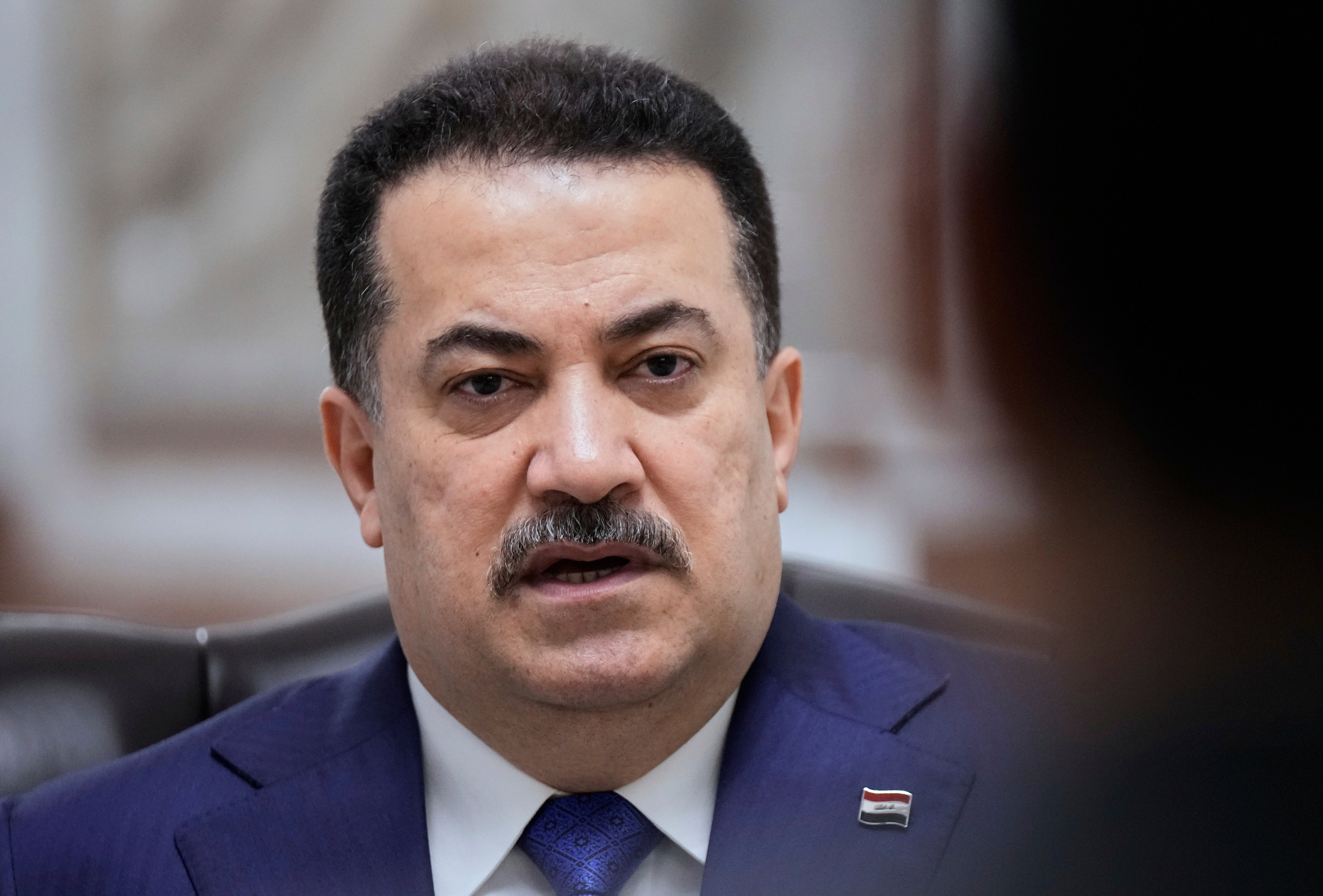 Iraq's prime minister seeks closer US ties while keeping armed groups at bay