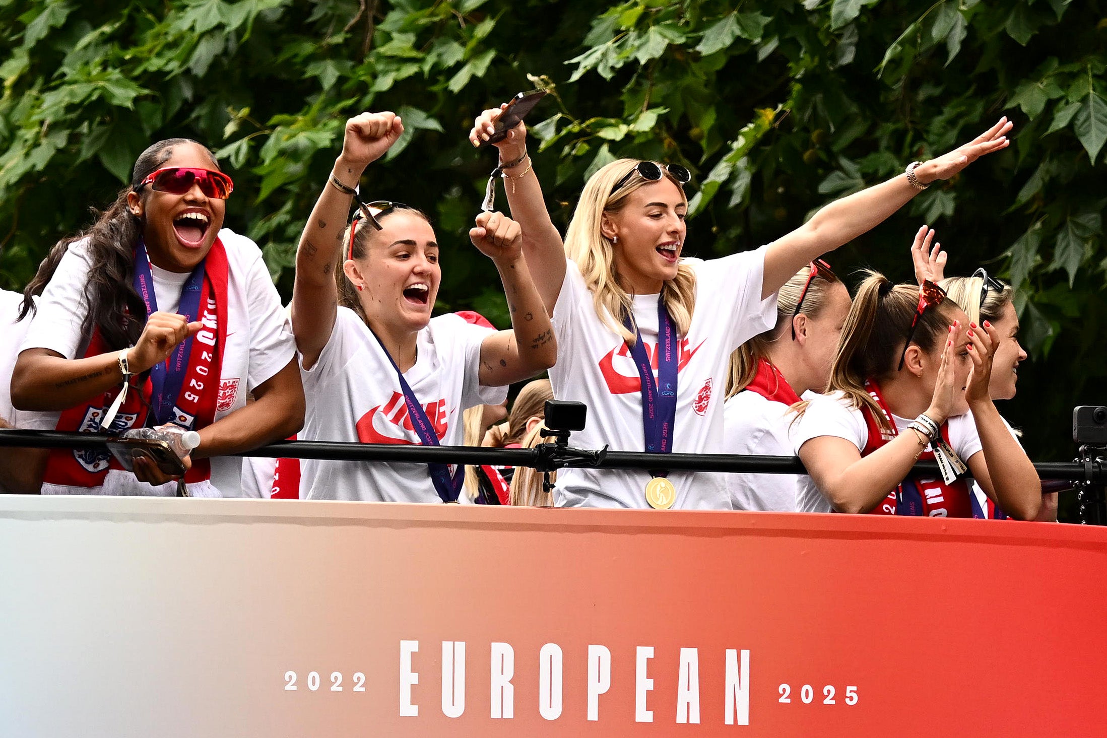 Kelly, right, celebrates with fans on The Mall