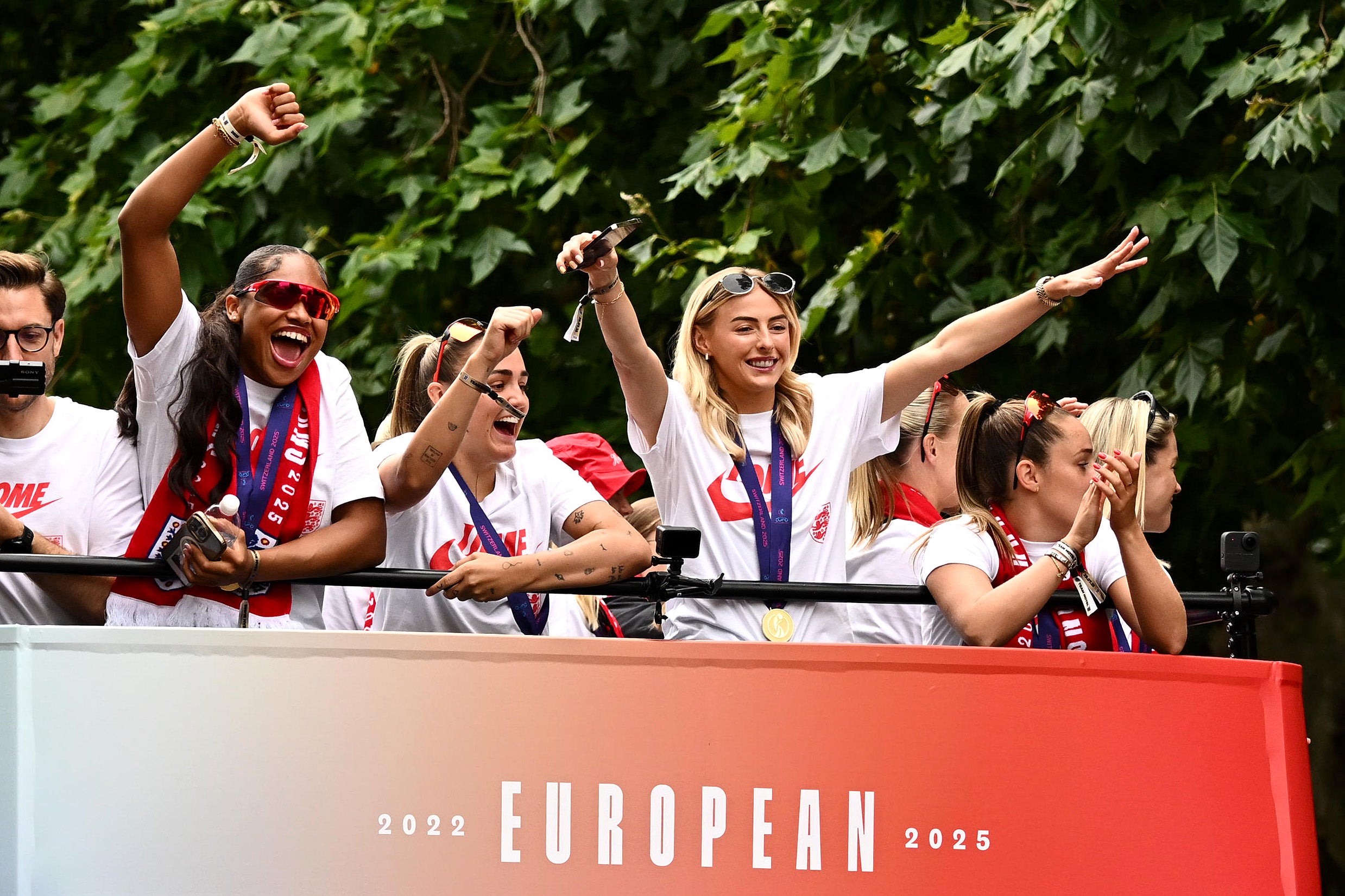 Chloe Kelly and England’s players celebrate on top of the open bus