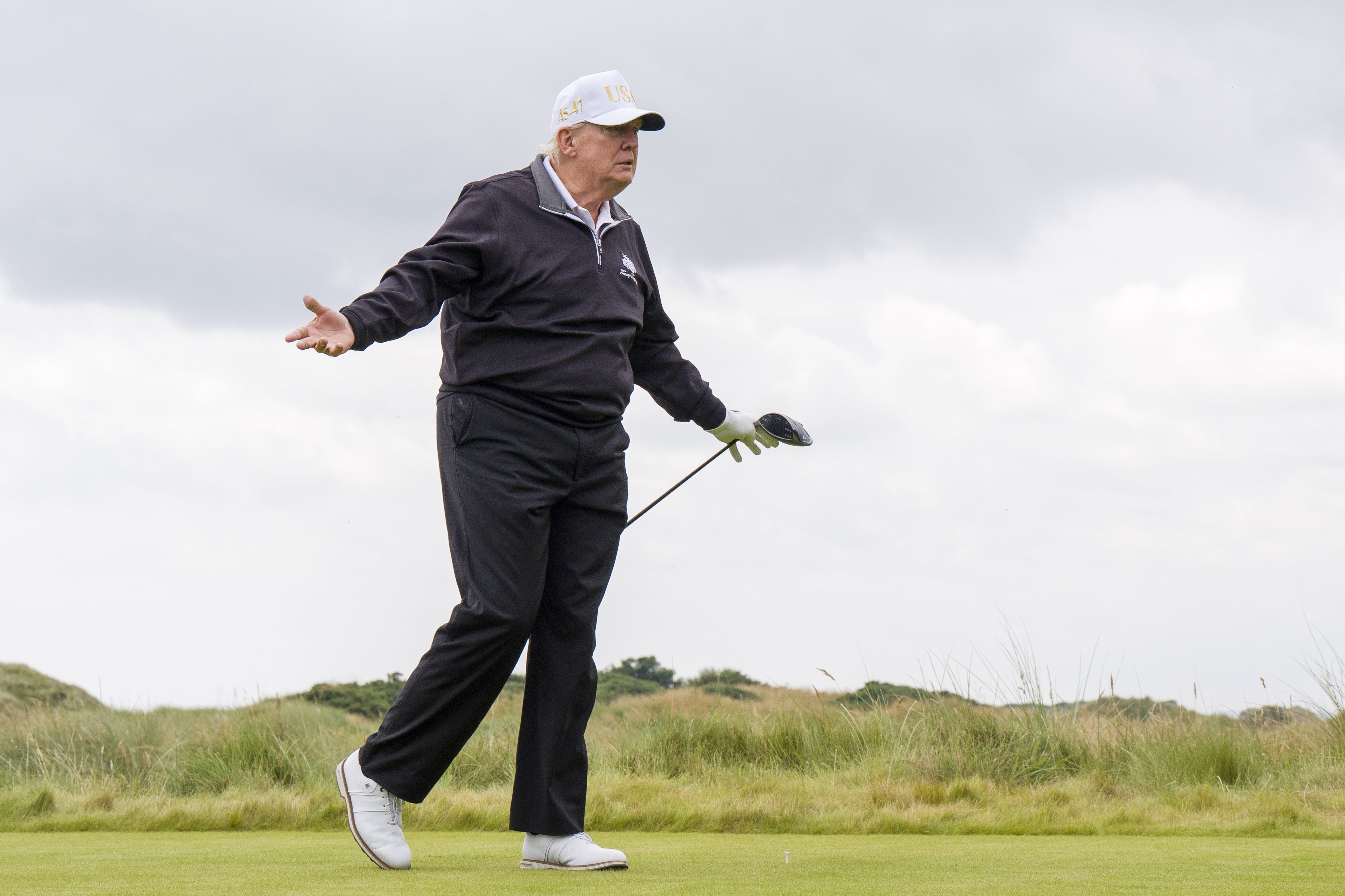US President Donald Trump after hitting a ball off the first tee to officially open the New Course, the second championship course at Trump International Golf Links, on the Menie Estate in Balmedie, Aberdeenshire