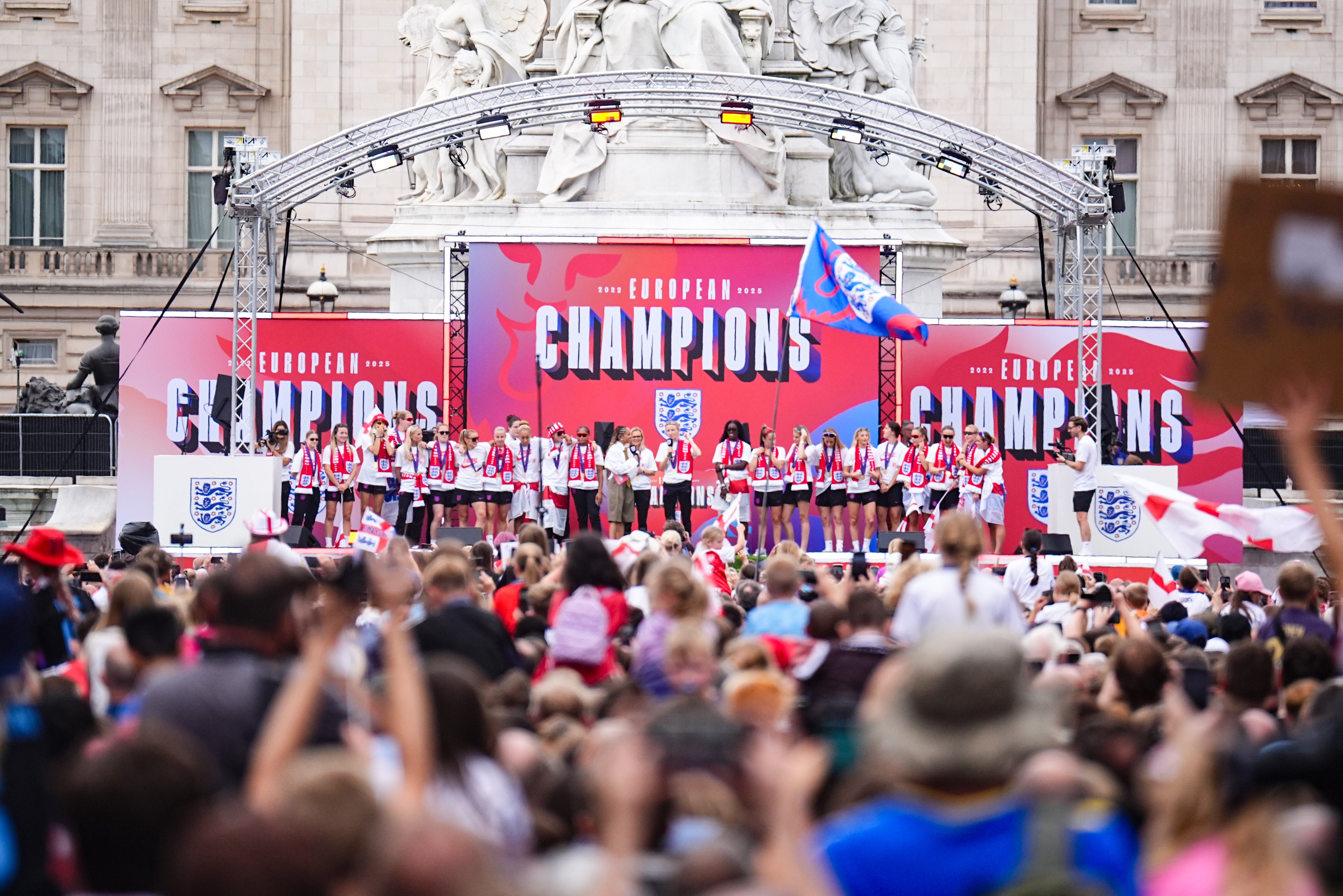 The Lionesses celebrated on stage in front of Buckingham Palace after an open-top bus parade (James Manning/PA)