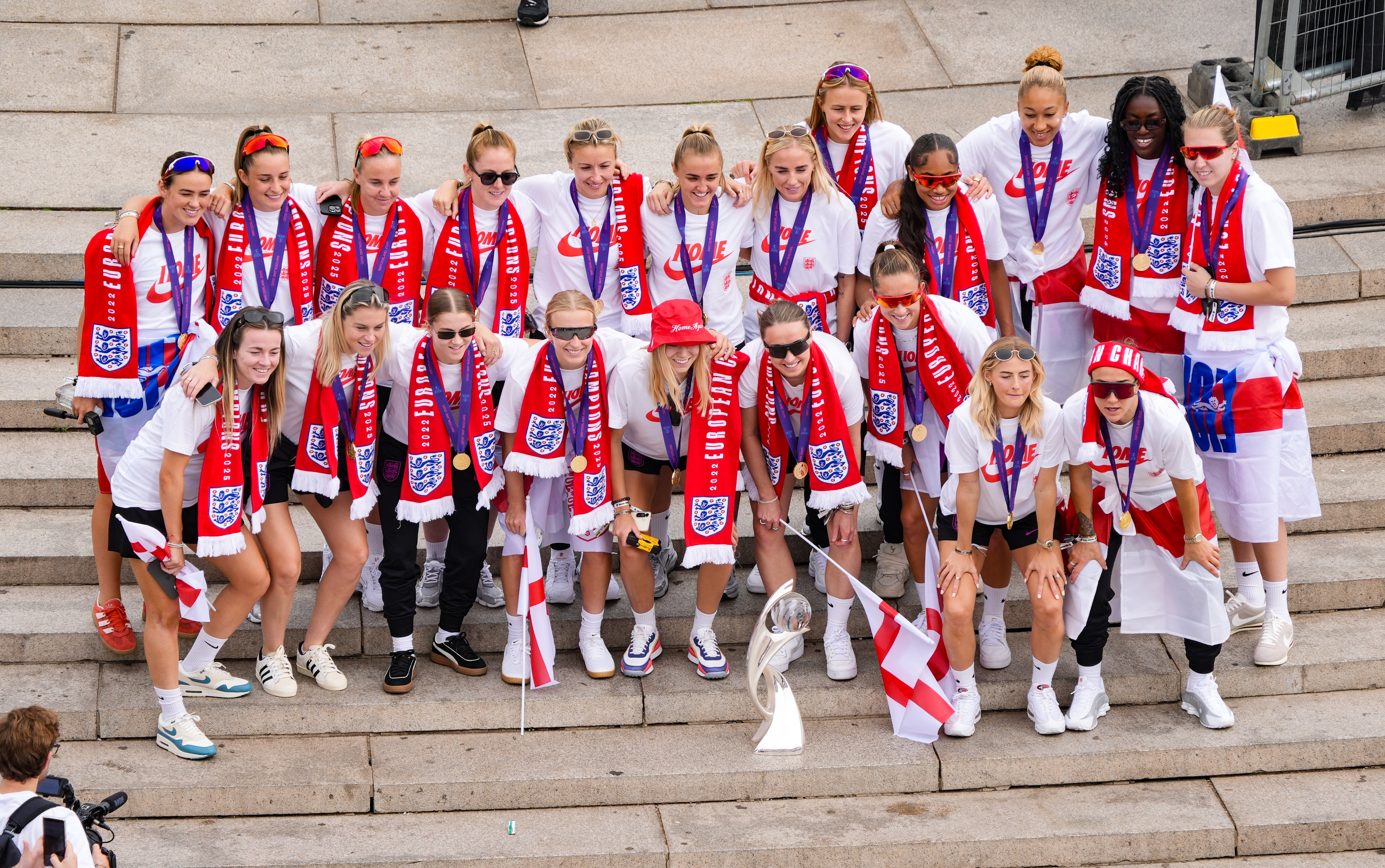 England players gathered on the steps of the Victoria Memorial during their homecoming victory parade (Yui Mok/PA)