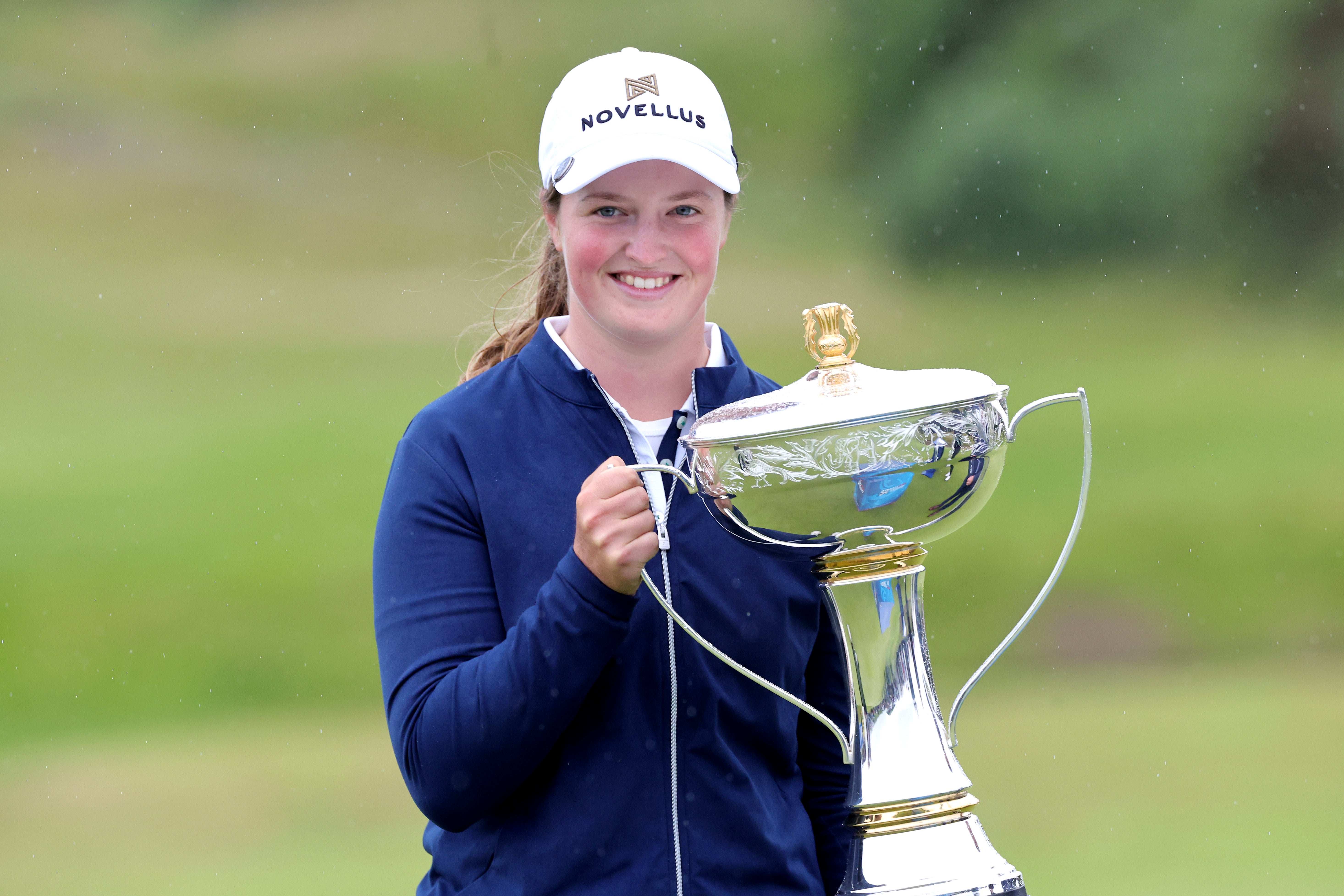 Lottie Woad celebrated winning the Women’s Scottish Open on her professional debut (Steve Welsh/PA)