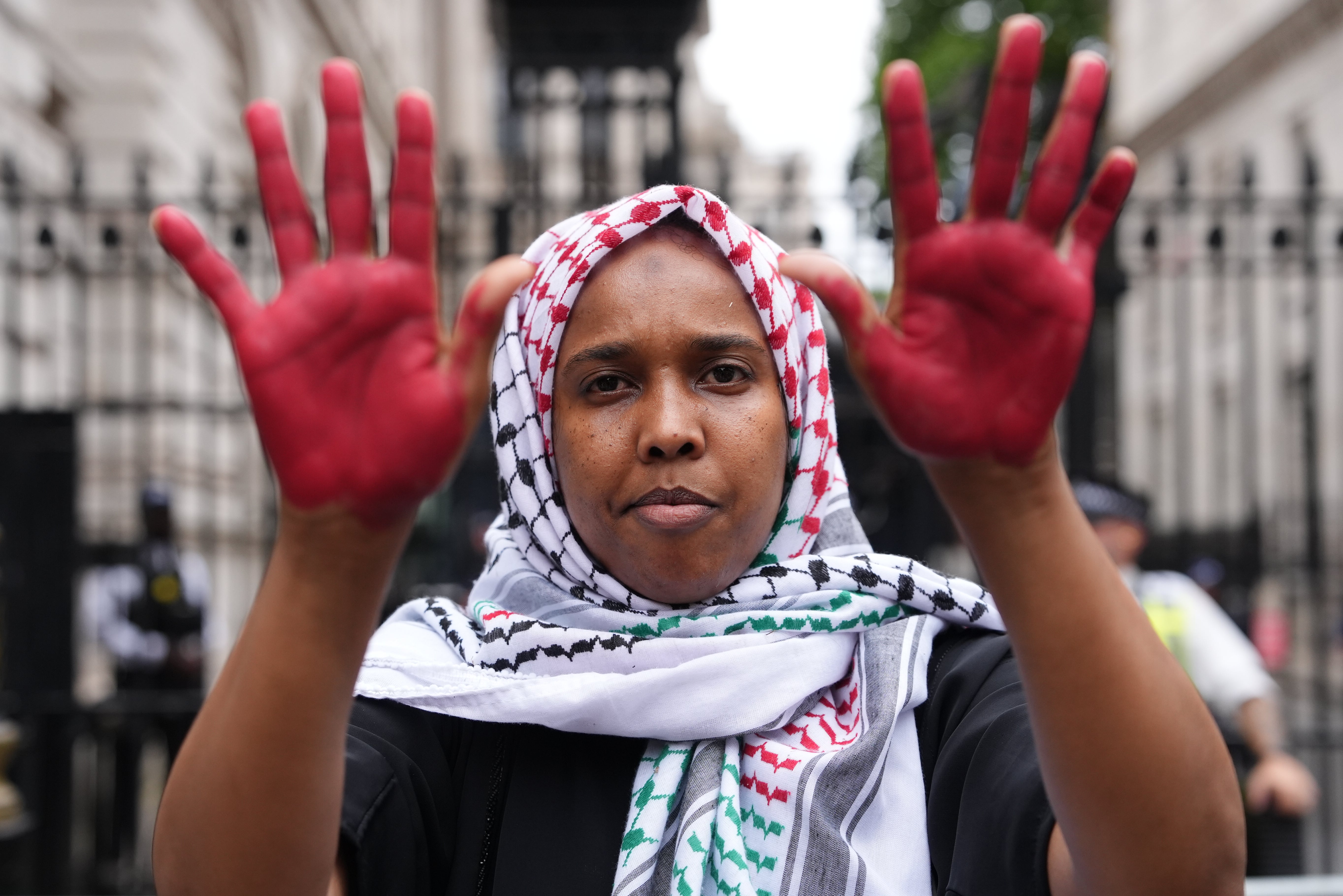 A protester claims the UK government has blood on its hands for supporting Israel