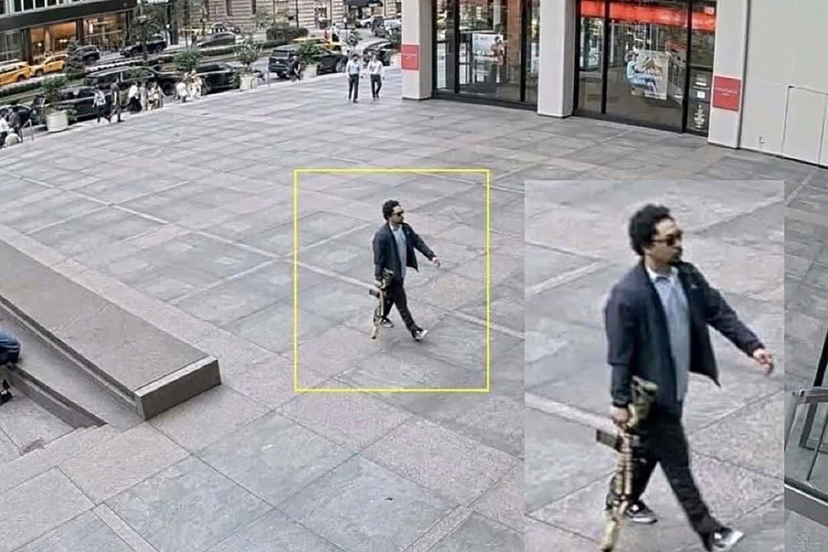 https://static.the-independent.com/2025/07/29/18/08/A-man-holding-a-rifle-walks-into-an-office-building-at-345-Park-Avenue-shortly-before-a-shooting-tha.jpeg?trim=0,0,195,0&width=1200&height=800&crop=1200:800