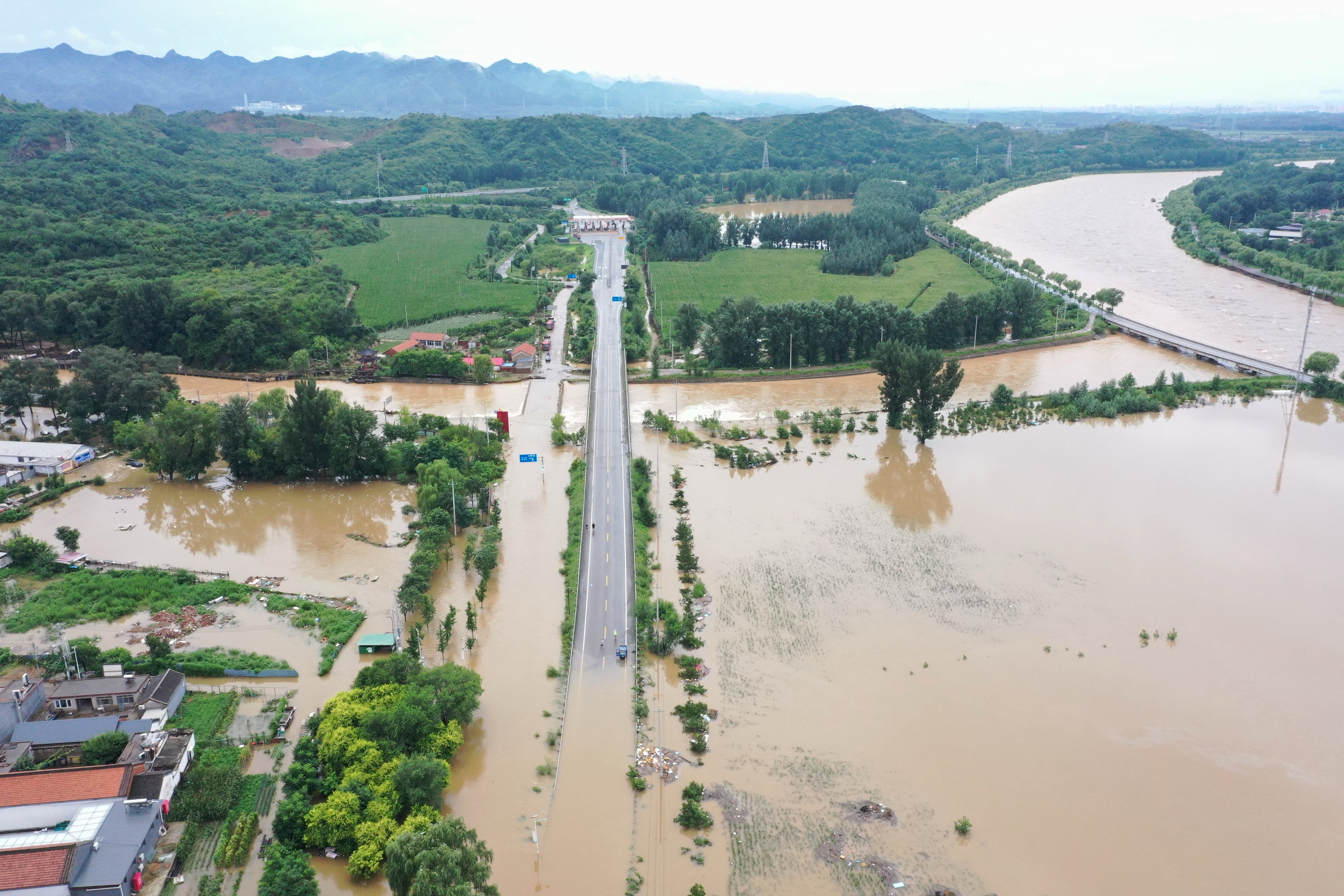 Flooding due to heavy rain at Xinanjuang village in Miyun district, on the outskirts of Beijing on July 29, 2025