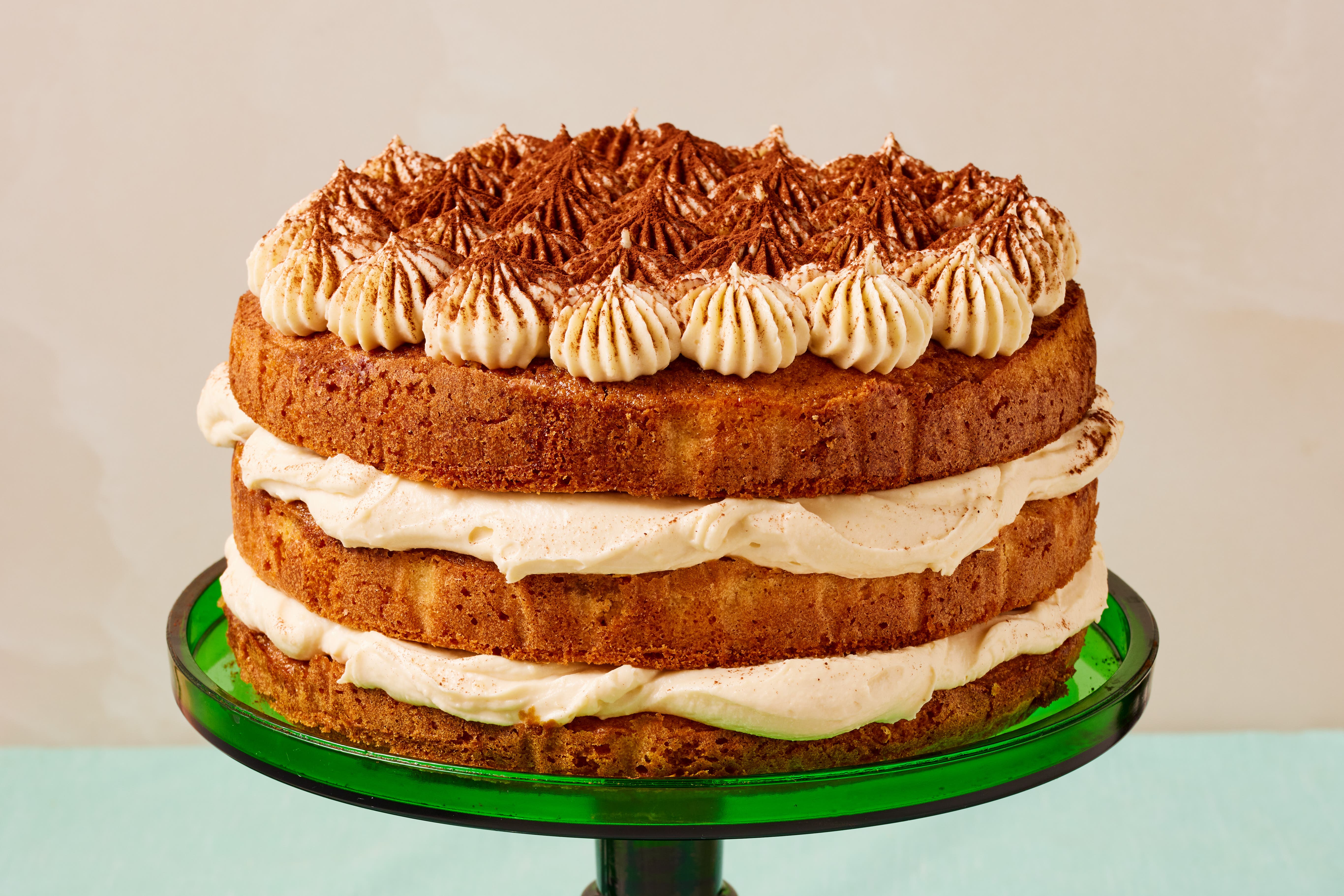 Layers of coffee-soaked sponge, whipped frosting and cocoa make this tiramisu cake a total showstopper