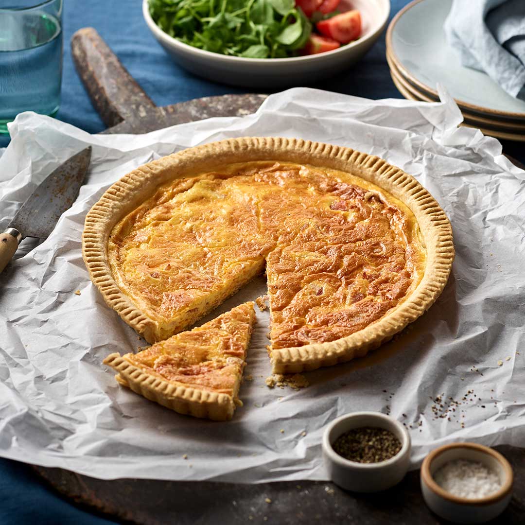 A crisp, buttery pastry base filled with smoky bacon, cheese and crème fraîche – a picnic staple