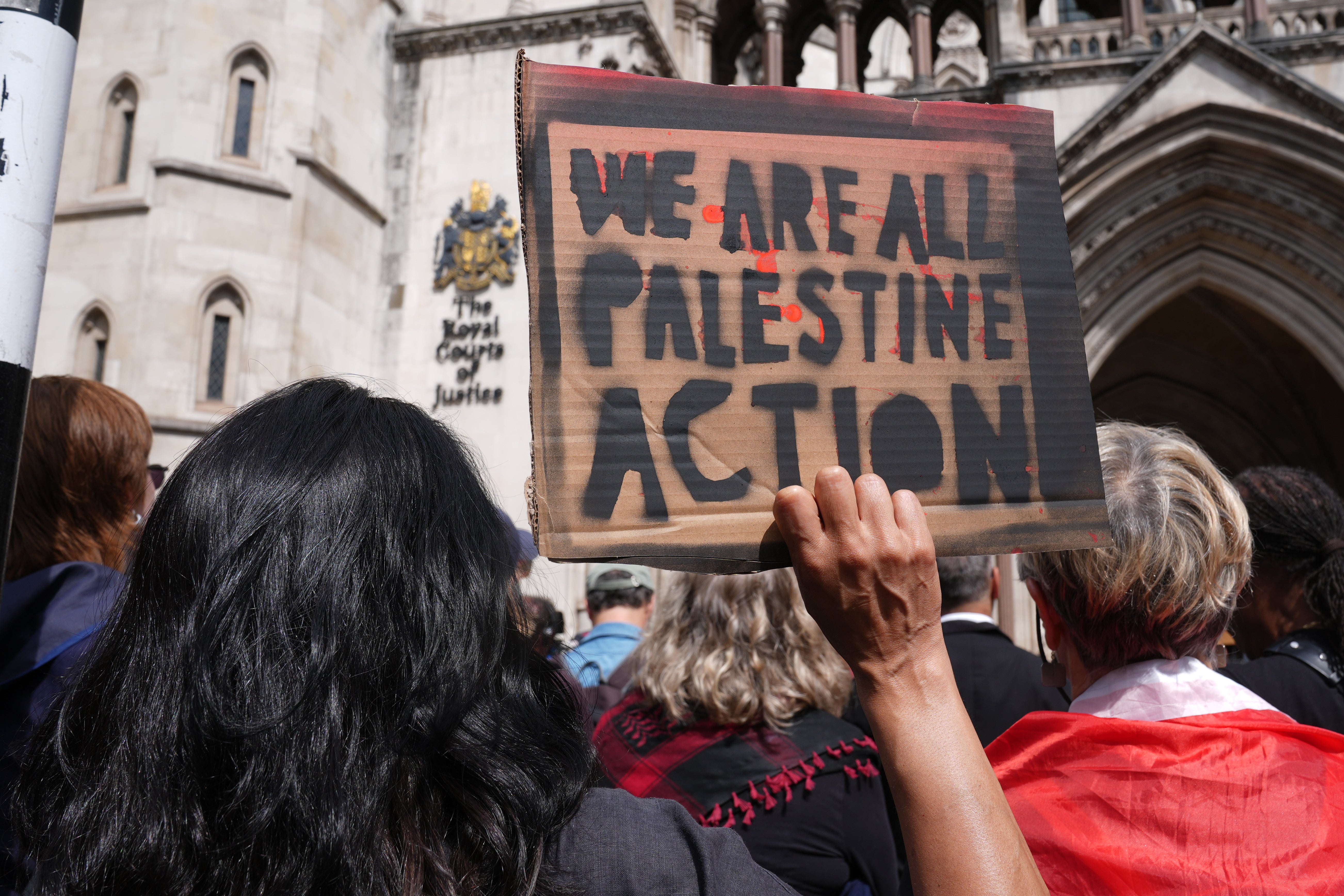 Protesters outside the Royal Courts of Justice on the Strand, central London, after it was ruled that Palestine Action could challenge the proscription