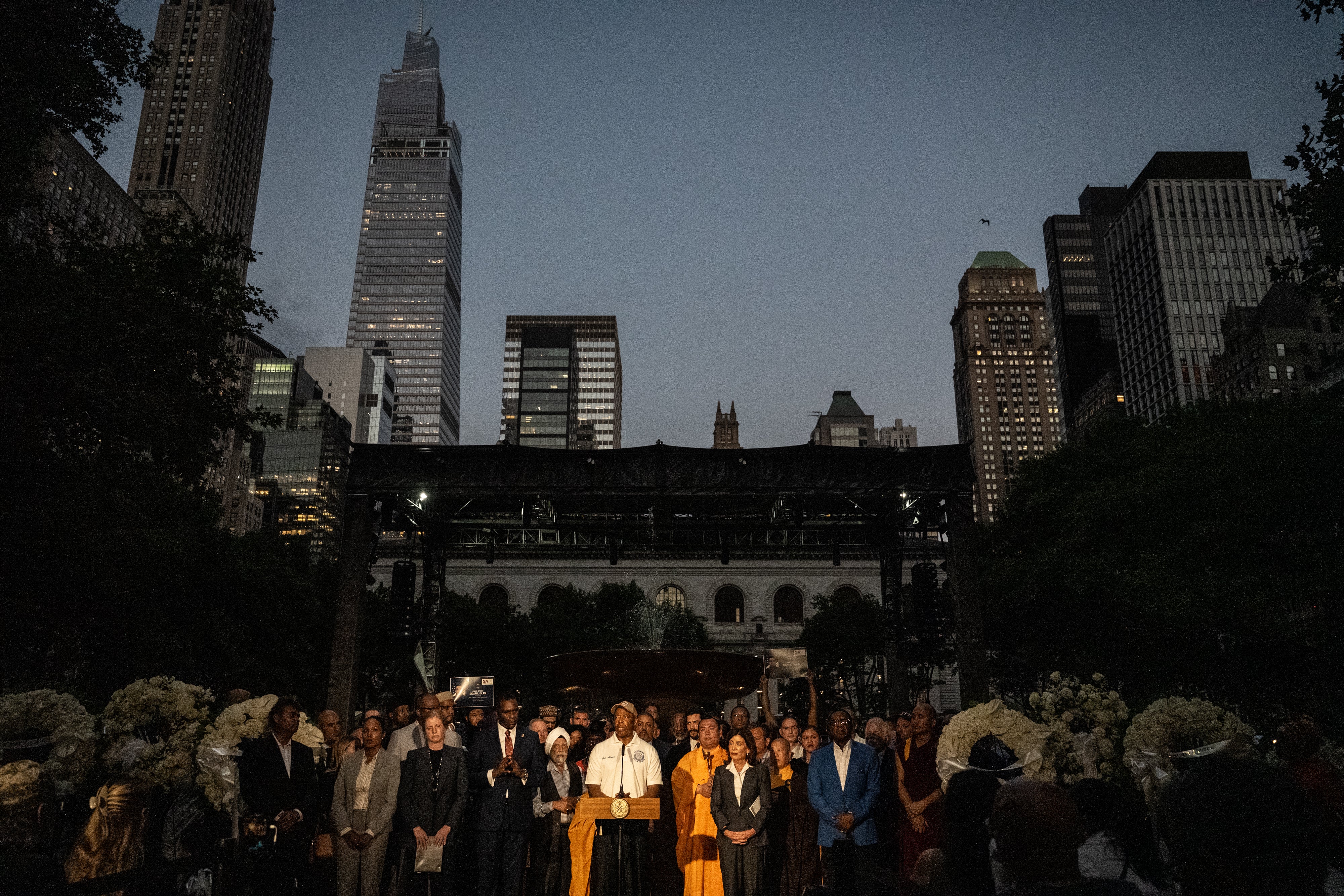 New York Mayor Eric Adams and other local leaders gather at a vigil to honor the four victims of Monday's shooting