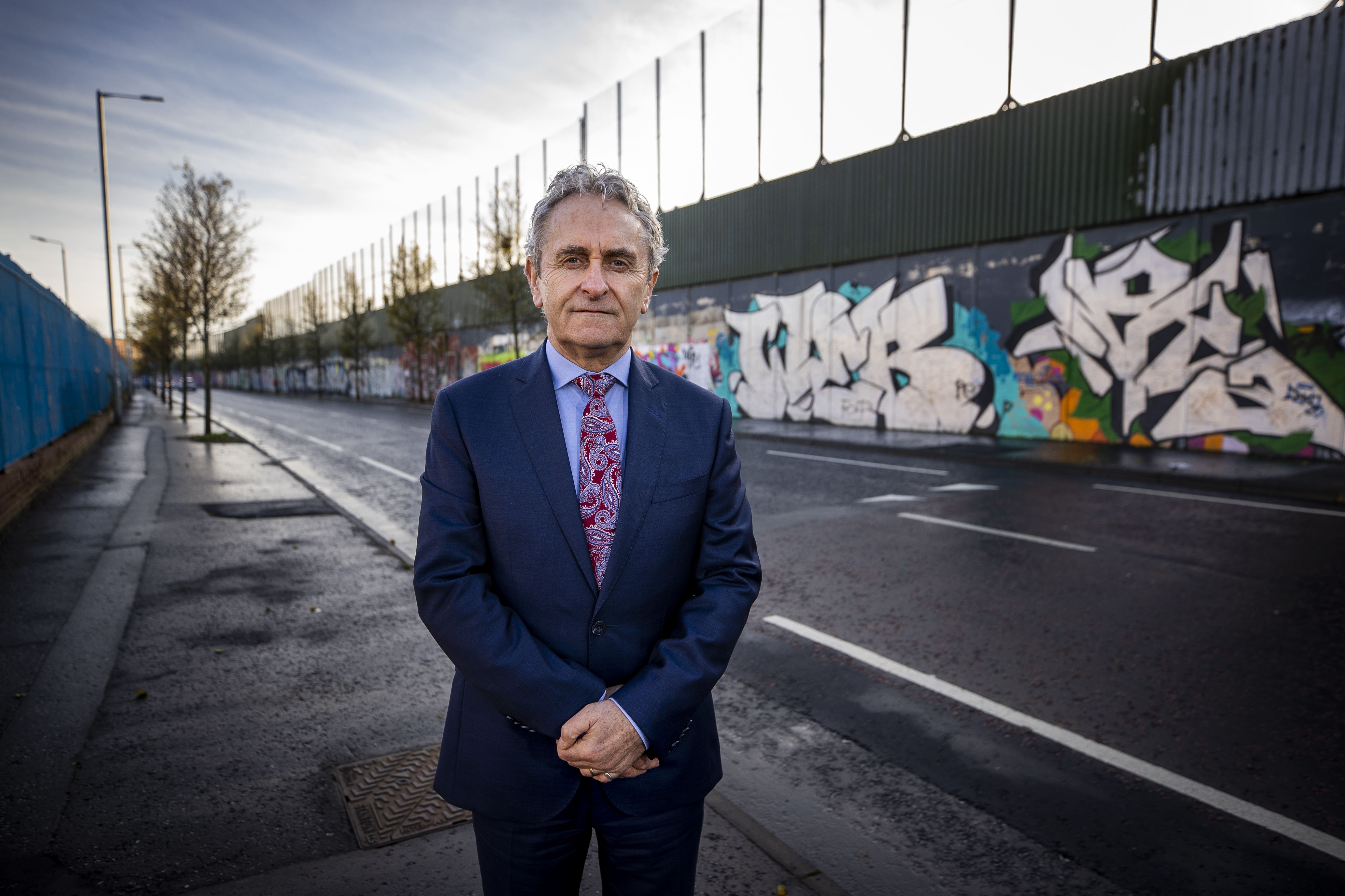 Paddy Harte, chairman of the Board of the International Fund for Ireland at Belfast’s Peace walls (PA)