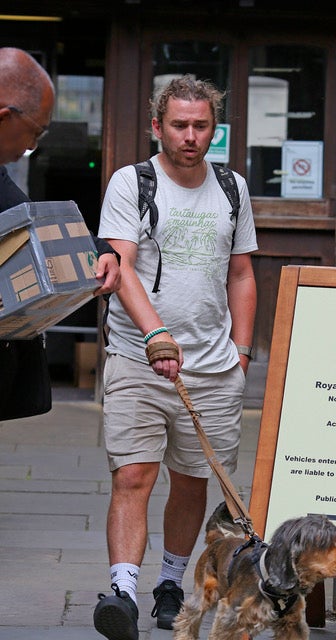 Cyclist James McLaughlin outside court with his support dog