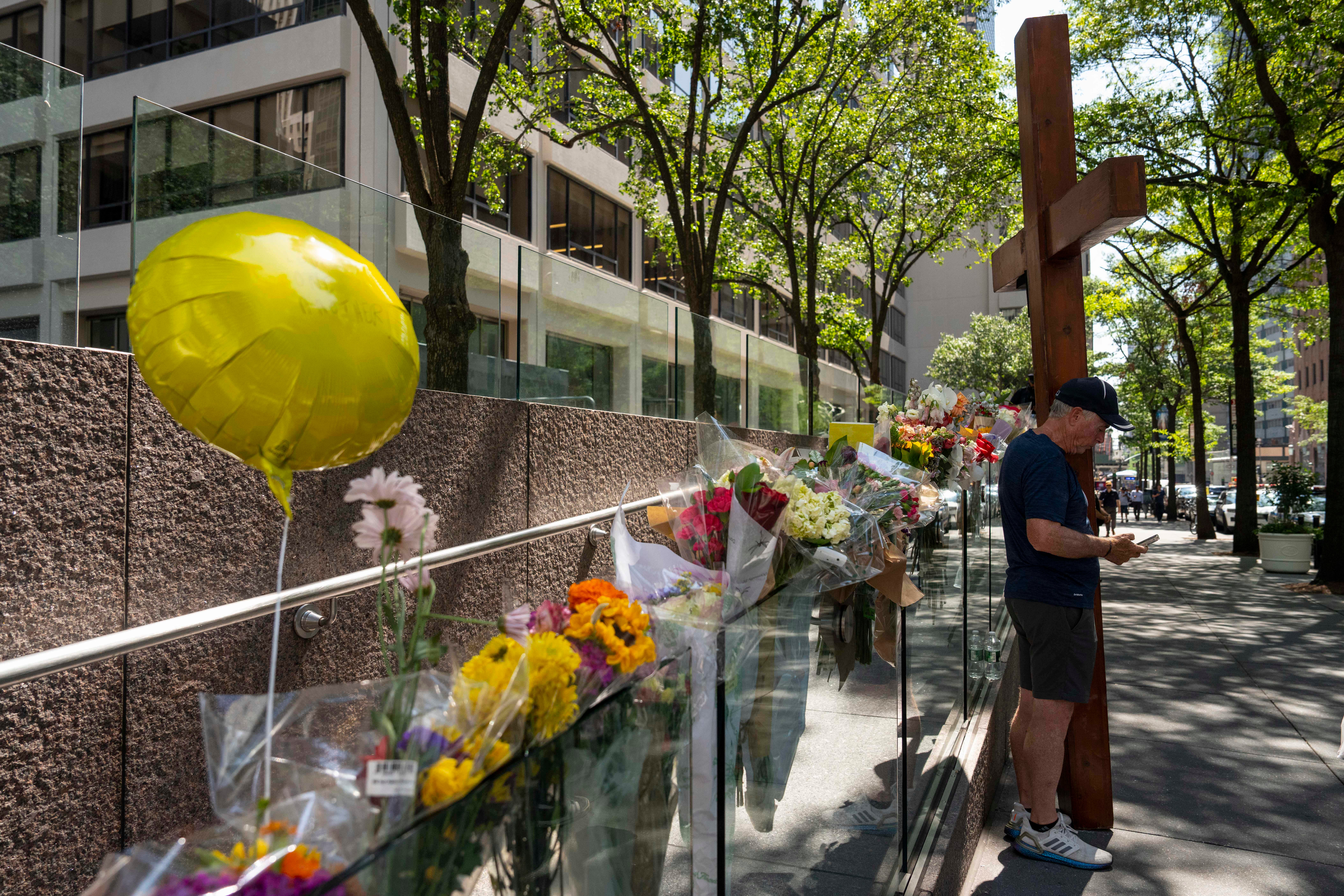 The courtyard of 345 Park Avenue continues to feature a memorial for the four victims of the shooting: NYPD detective Didarul Islam, Blackstone executive Wesley LePatner, Rudin Management employee Julia Hyman and security officer Aland Etienne